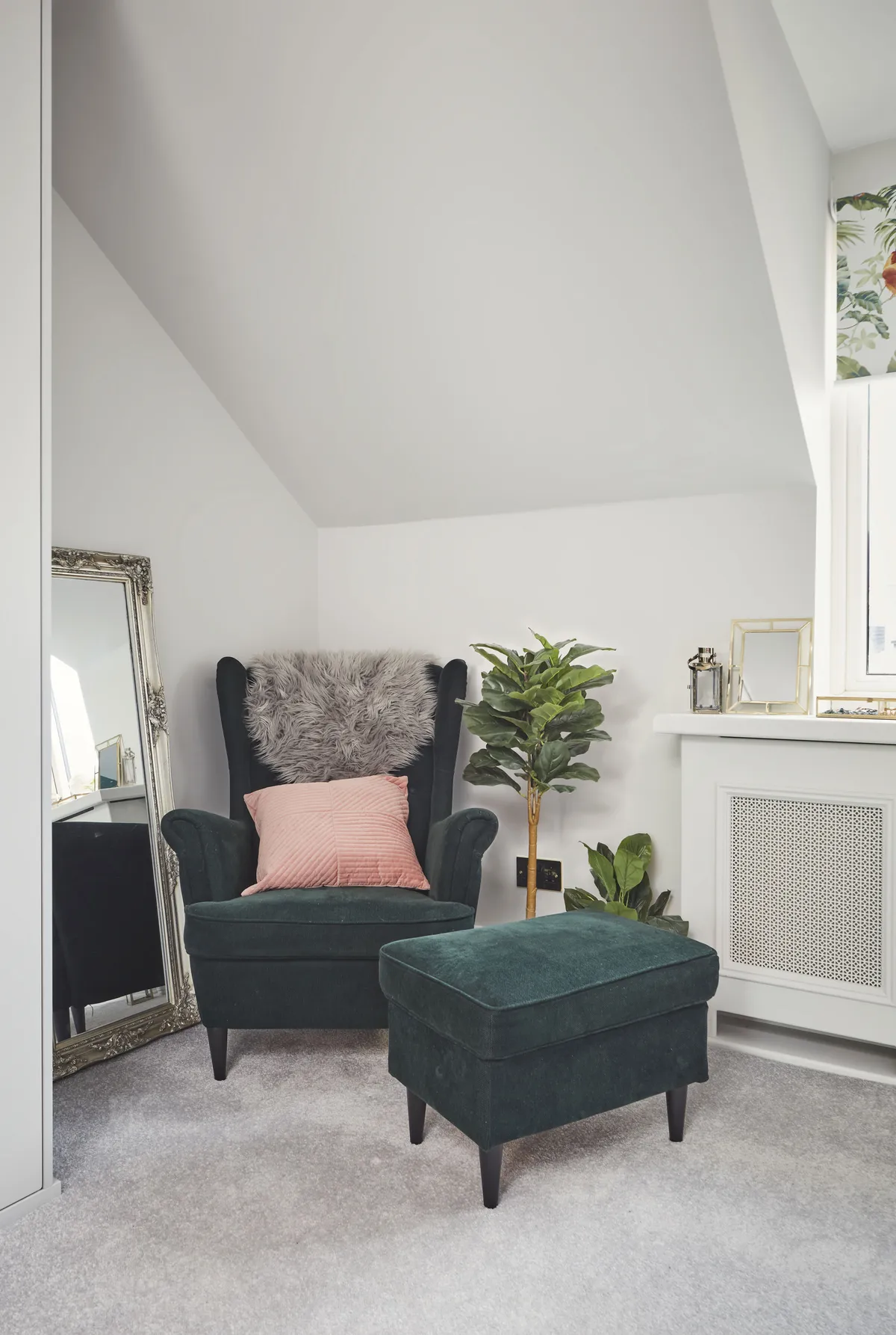 Anne Marie found this bargain velvet chair on a classified site, and has made it even more inviting by styling it with a pink cushion and faux sheepskin throw. The ornate silver mirror was a gift from her sister, and is propped up against the wall for a relaxed look
