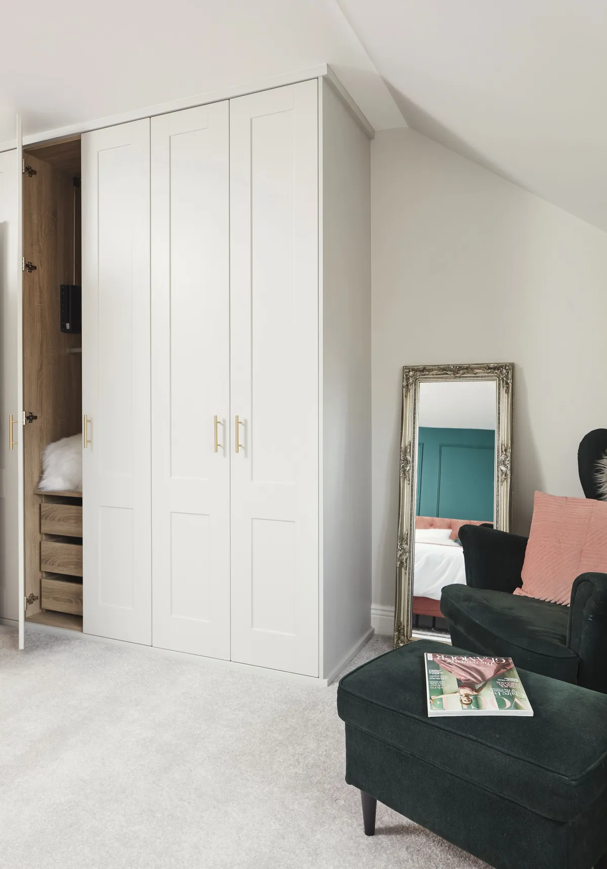 The unobtrusive bank of built-in wardrobes provides extra storage and keeps the space clutter-free. Painted in the same colour as the walls, French Grey Pale by Little Greene, it doesn’t dominate the space