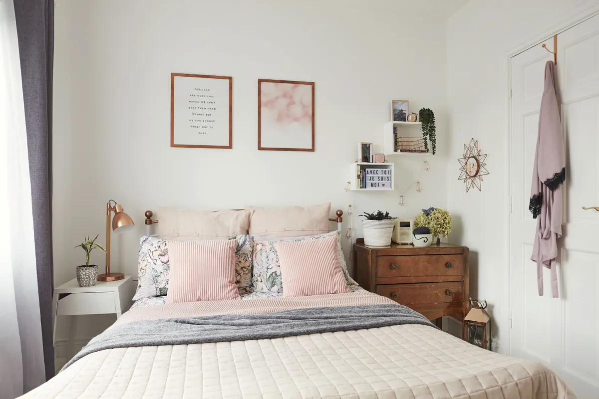 ‘I kept this room very neutral, for a calm, relaxing feel. I love to dress the bed with layers of cushions and throws – from Primark and Next – so it looks really warm and cosy. I picked up the curtains and side table in IKEA,’ says Ediana