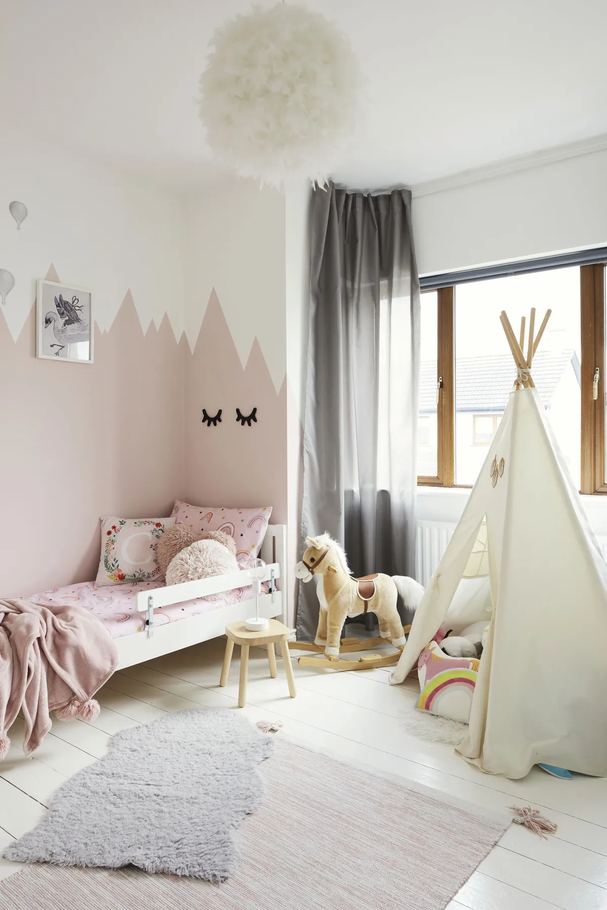 ‘Caoimhe insisted her room was painted pink, so we went for Morning Blush 24 by Fleetwood Paints. To make it really magical, we added the mountain mural and balloon stickers from Lamb Design. The tent is from Etsy and the furniture is from IKEA’