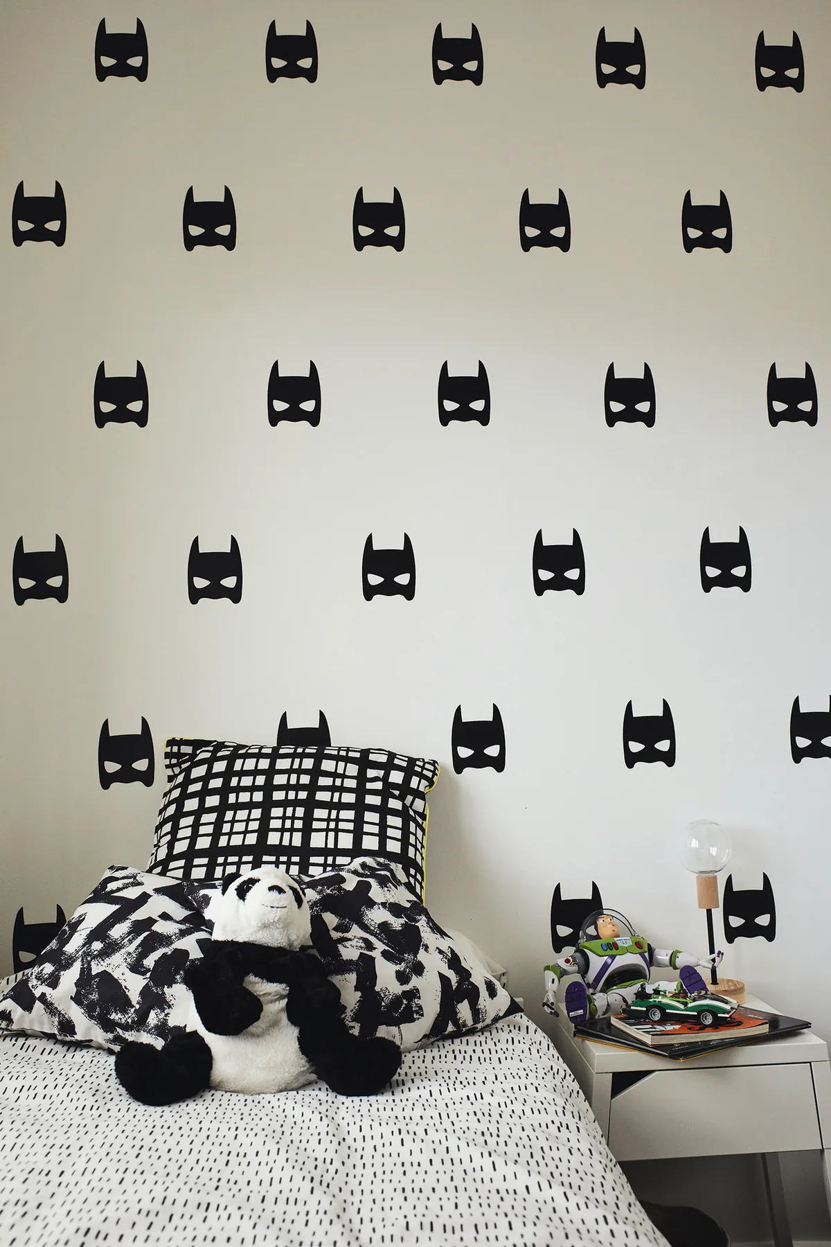 ‘Oisin loves Batman and Lego so we carried this theme into his room. We found the batman vinyl stickers on Etsy and picked up some black and white bedding in H&M Home’
