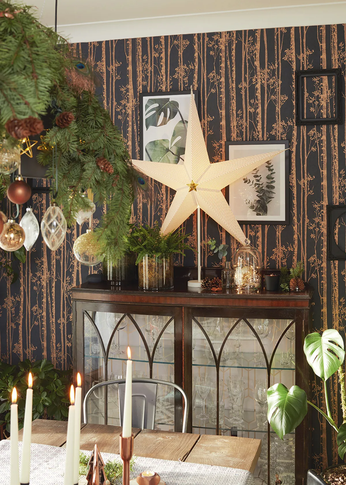 ’I try to recycle and use natural greenery as much as possible – it brings in that lovely Christmas smell,’ says Ediana. ‘This was the first wall I ever wallpapered and it’s my greatest DIY achievement. It wasn’t as difficult as I thought and it sits well with my glass cabinet I found in a charity shop’