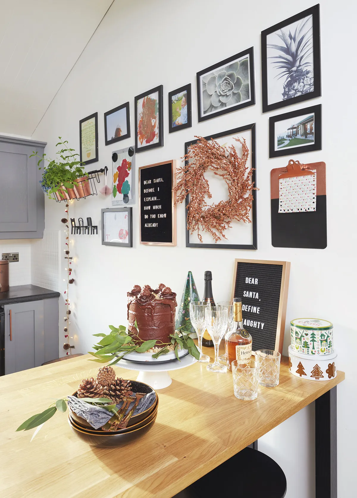 Ediana created a gallery wall using frames from IKEA. She spray-painted the plant pots copper and found a coordinating wreath in HomeSense. The chair hangers are from IKEA