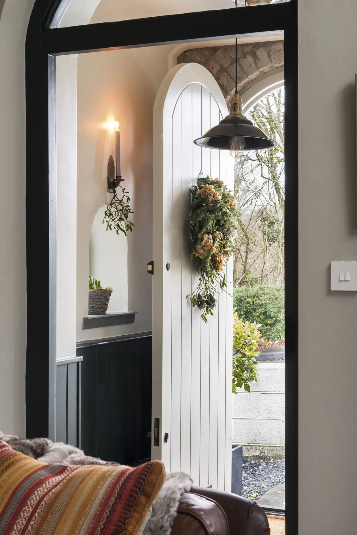 The internal double doors were full of flaws, all bowed and buckled with a rotting wooden frame that the couple repaired themselves. They also replaced the front door with a characterful one