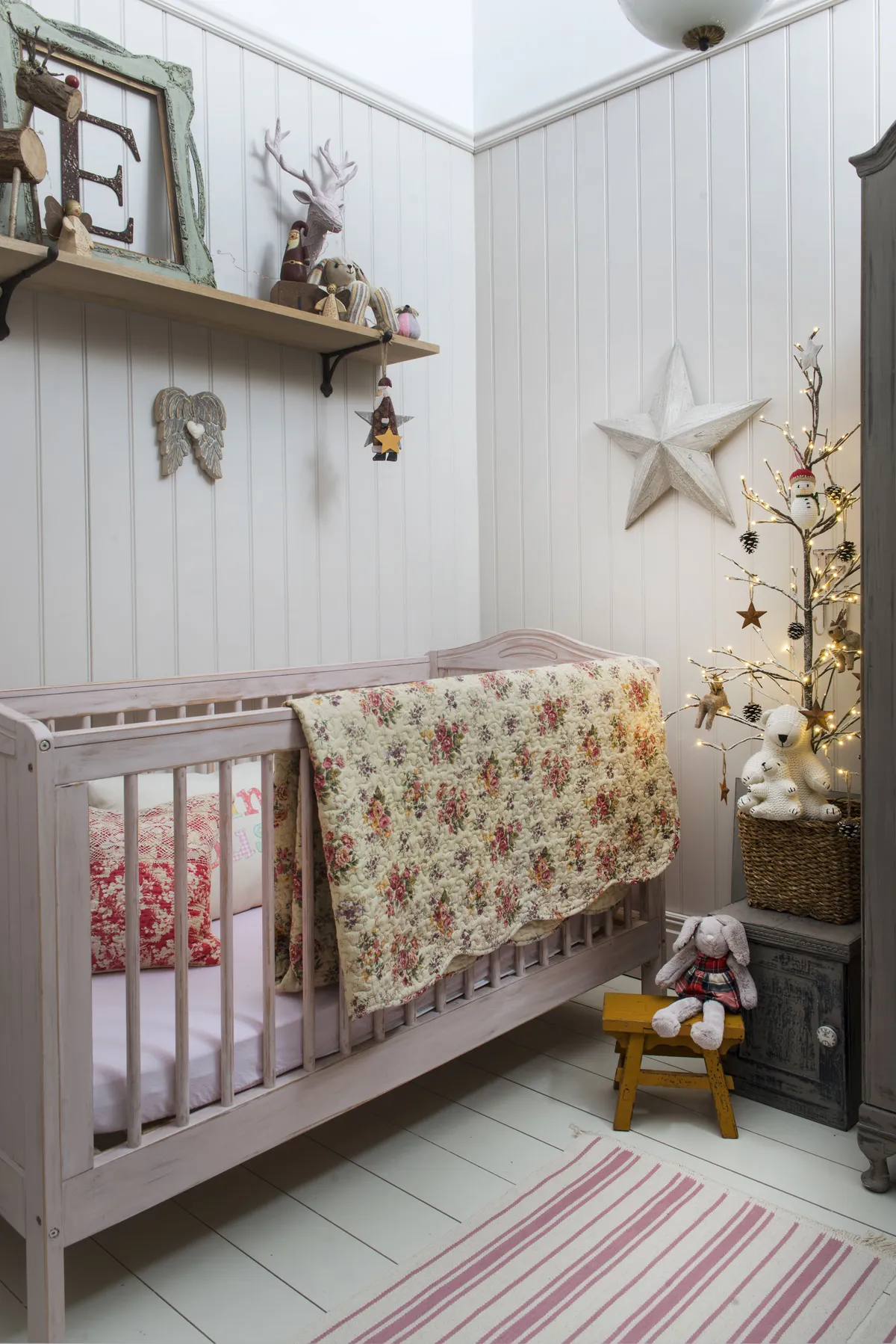 Kay and Paul created a bedroom for their granddaughter, Evie, and it looks particularly magical with a touch of festive sparkle. ‘The cot was a bargain from Gumtree, which I painted in Annie Sloan’s non- toxic Antoinette chalk paint,’ says Kay. ‘The floral throw is also vintage’