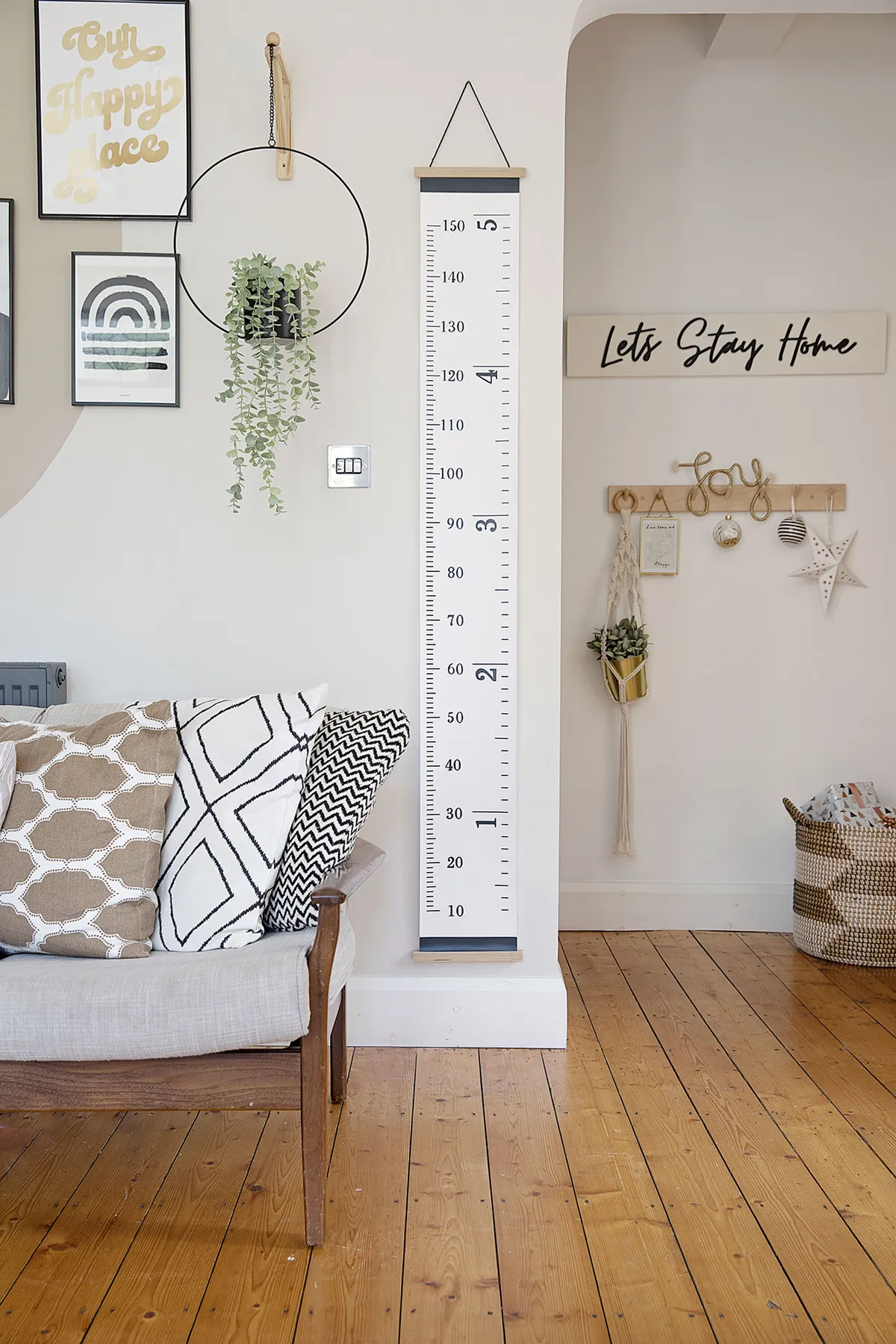 Next to the giant height ruler from H&M Home, Louise has adapted a Sainsbury’s metal plant hanger by attaching a bracket from B&Q. ’My friend’s husband – who owns White Attic Design – made the Let’s Stay Home sign,’ Louise recalls. ‘Who knew it would become so apt in 2020!’
