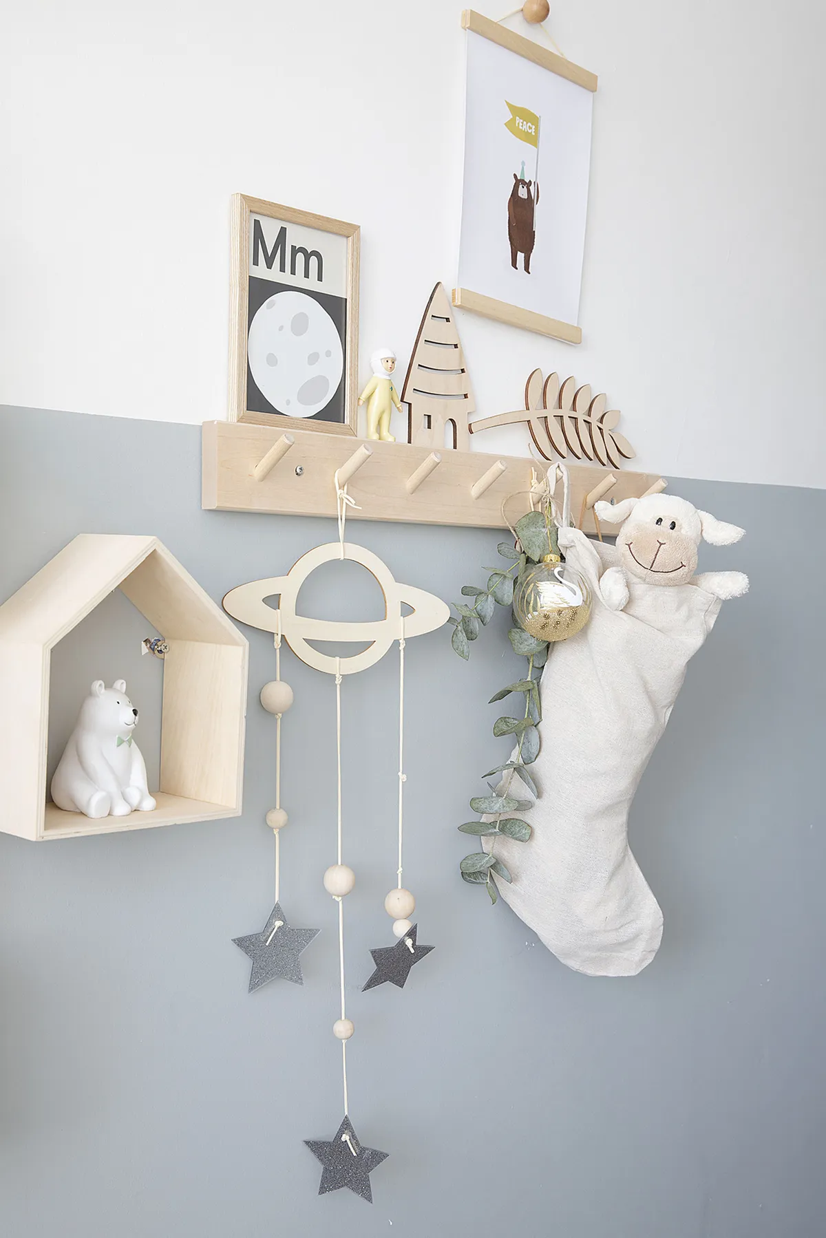 ‘Peg rails are so versatile as you can keep updating and restyling the accessories or use them for clothes,’ Louise explains. The moon picture is by Lorna Freytag, the bear print by Minii and Maxii and Lala Loves Decor sells a similar space mobile