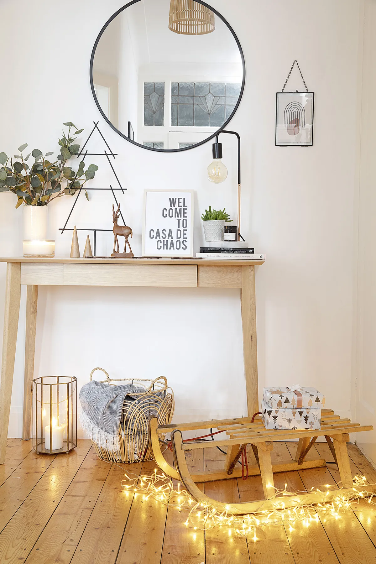 Graphic shapes like the metal tree and mirror from Søstrene Grene give the console table from Jysk a contemporary look. ‘We sometimes have a mini Christmas tree on the vintage sleigh or put the kids’ Christmas Eve boxes on there, as if the elves have delivered them,’ says Louise