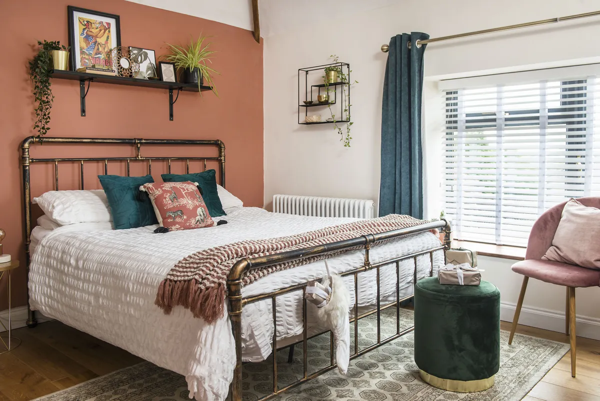 The couple painted their main bedroom in Pimlico by GoodHome at B&Q. ‘It took me quite a while to feel confident enough to use bolder colours in the house,’ says Amy. ‘I always tell myself I can change them if I really hate it!’ The gold side table is from Maisons du Monde and the pink chair is from eBay