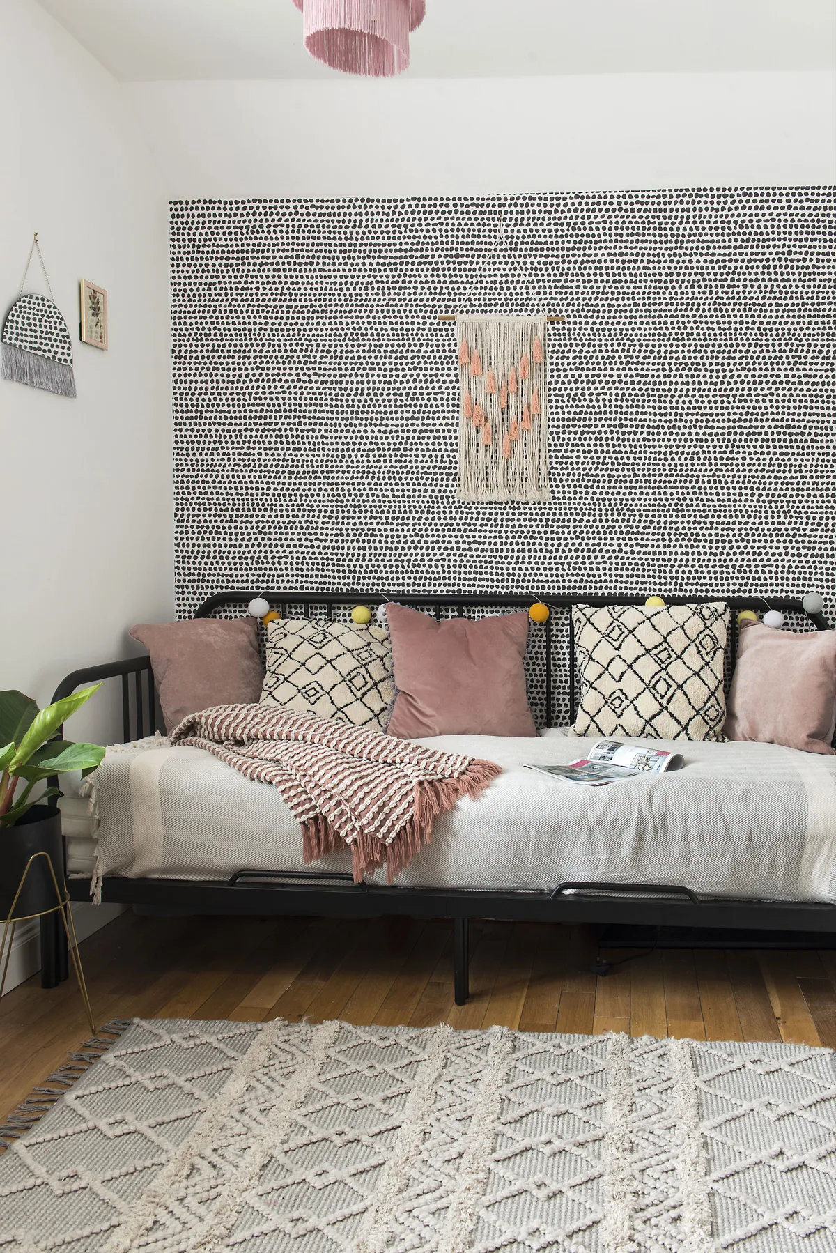 The third bedroom is used as a snug, with a daybed from IKEA and Berber cushions from Next. ‘I tried hand-painting a Dalmatian-print mural in this room, which went disastrously wrong,’ says Amy. ‘So, I bought this wallpaper from Graham & Brown instead!’