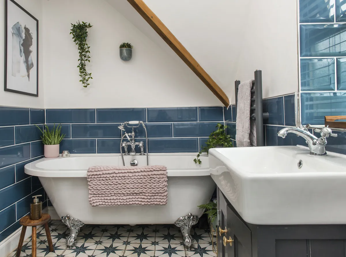 The V&A metro wall tiles in Sykes Blue are from British Ceramic Tile and the floor is tiled in Scintilla Sapphire Star tiles from Walls and Floors. The roll-top bath was purchased from Victorian Plumbing