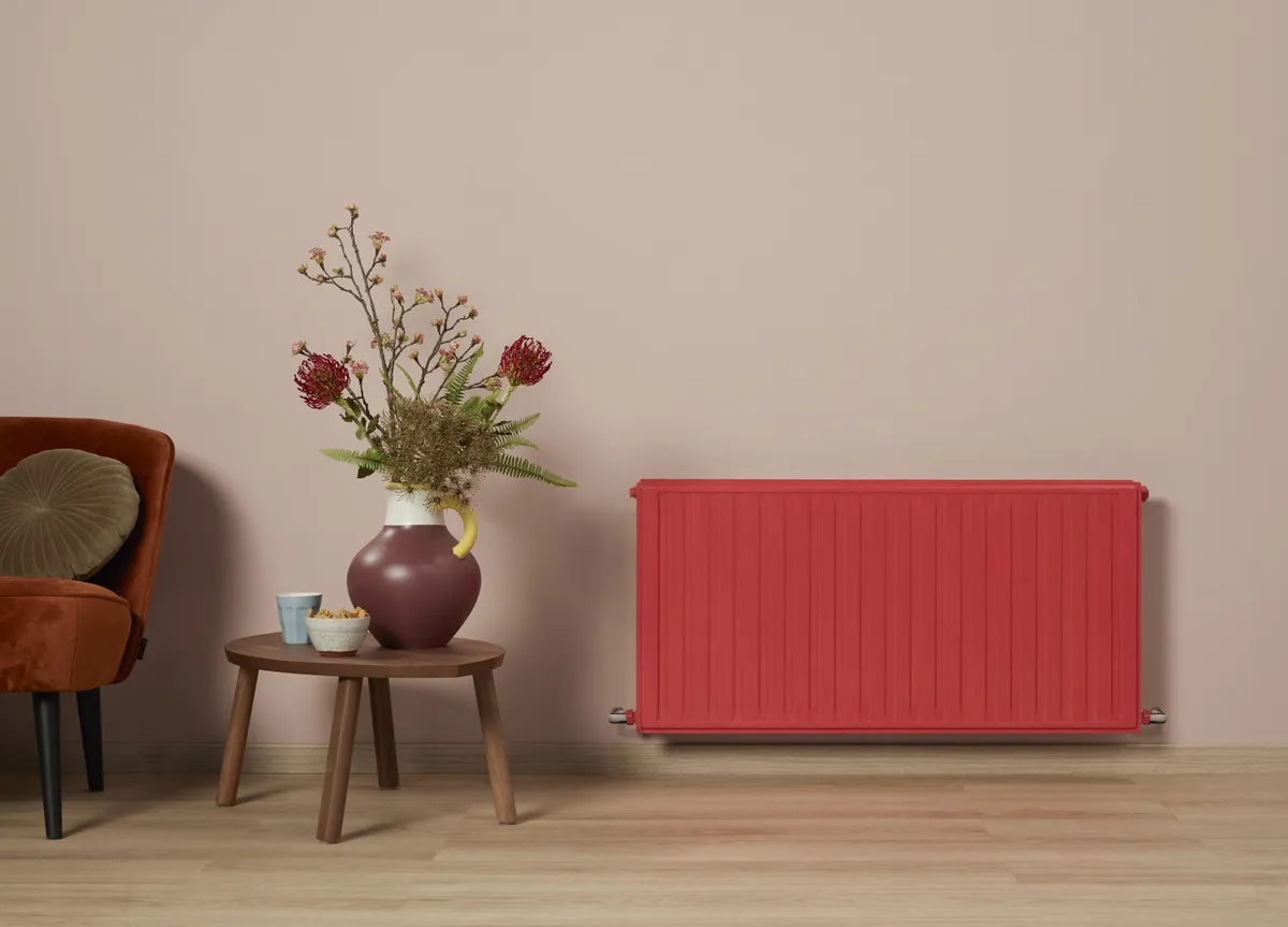Radiator painted in quick dry satinwood in Pepper Red, around £16.50 for 500ml, Dulux