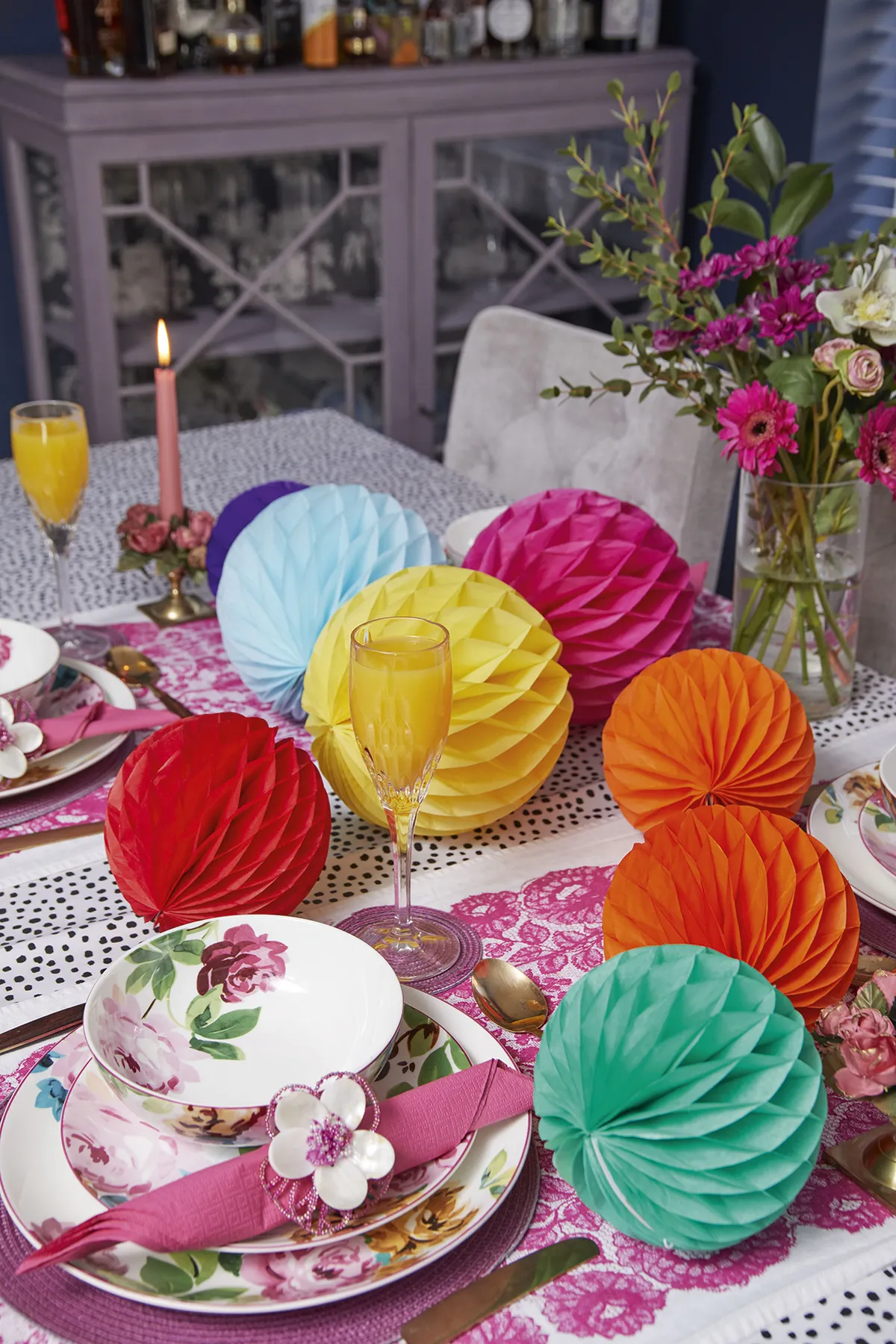 ‘I love creating a tablescape, which of course usually includes a paper pompom or two. Layering up these pretty dishes from M&S with simple paper napkins adds the finishing touch’