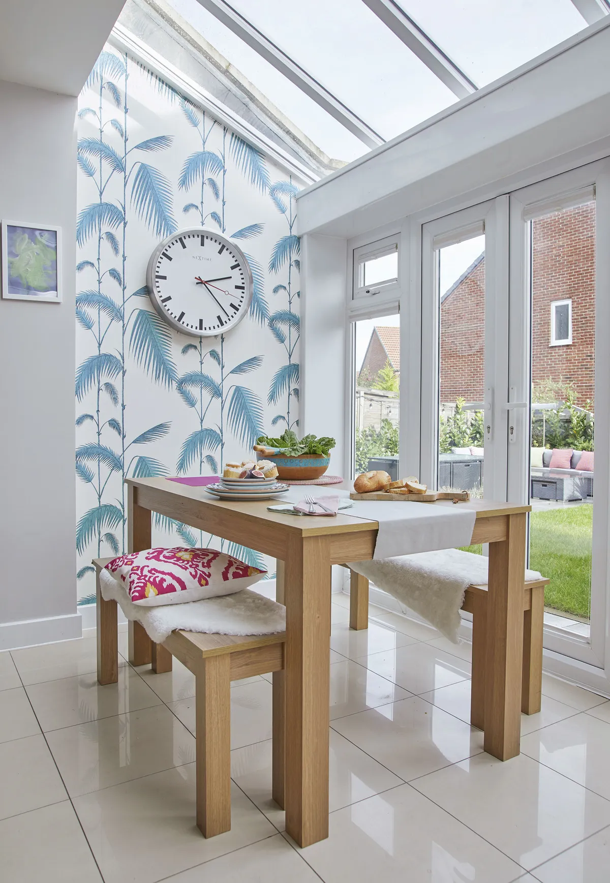 ‘I bought this Cole & Son wallpaper from eBay but there was only one roll. I wasn’t sure where to use it, and initially thought it might go in the bathroom, but it works really well here. We bought the dining set off the previous owners as it works well in the space’