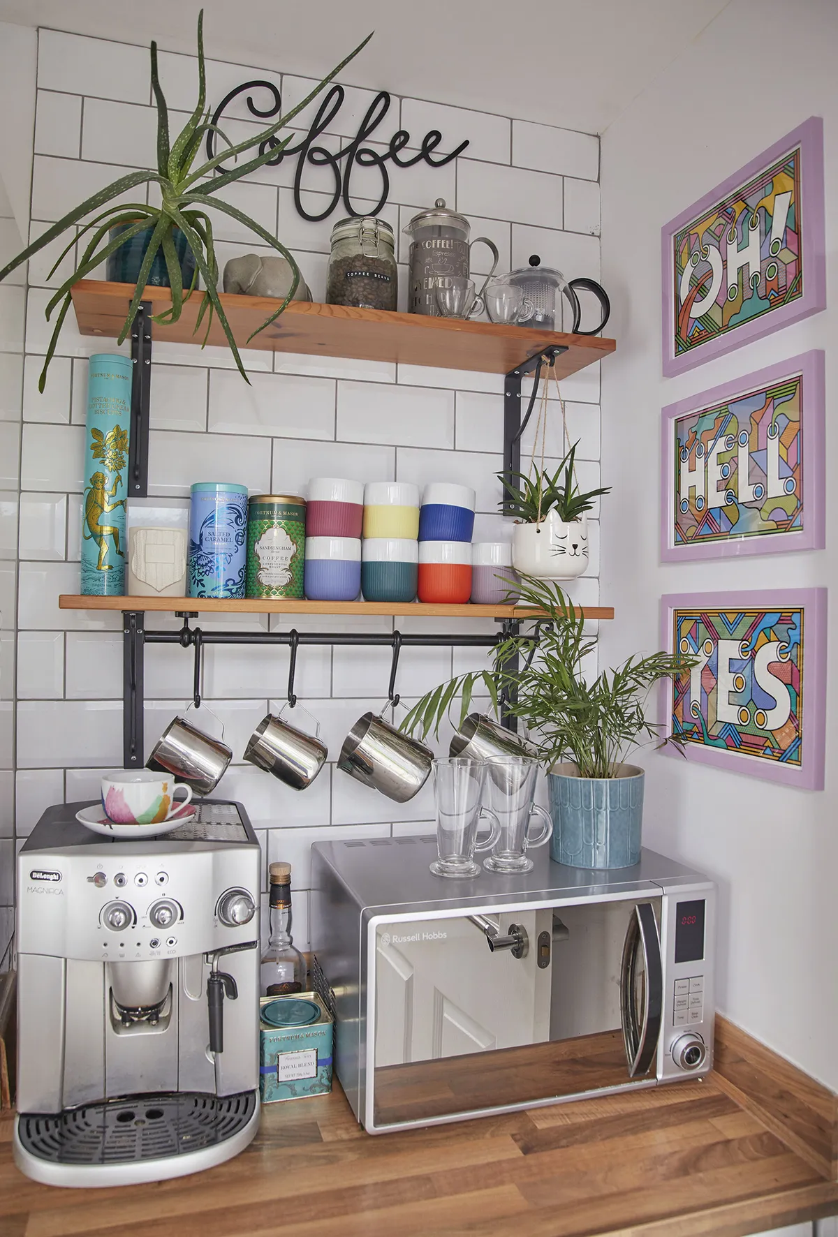 ‘We call this our ‘Caffeine Station’. This was meant to be a utility room, but we both love coffee so we decided to make it into an area that would brighten our mornings. The ‘Oh Hell Yes’ prints are by the illustrator Rob Lowe’