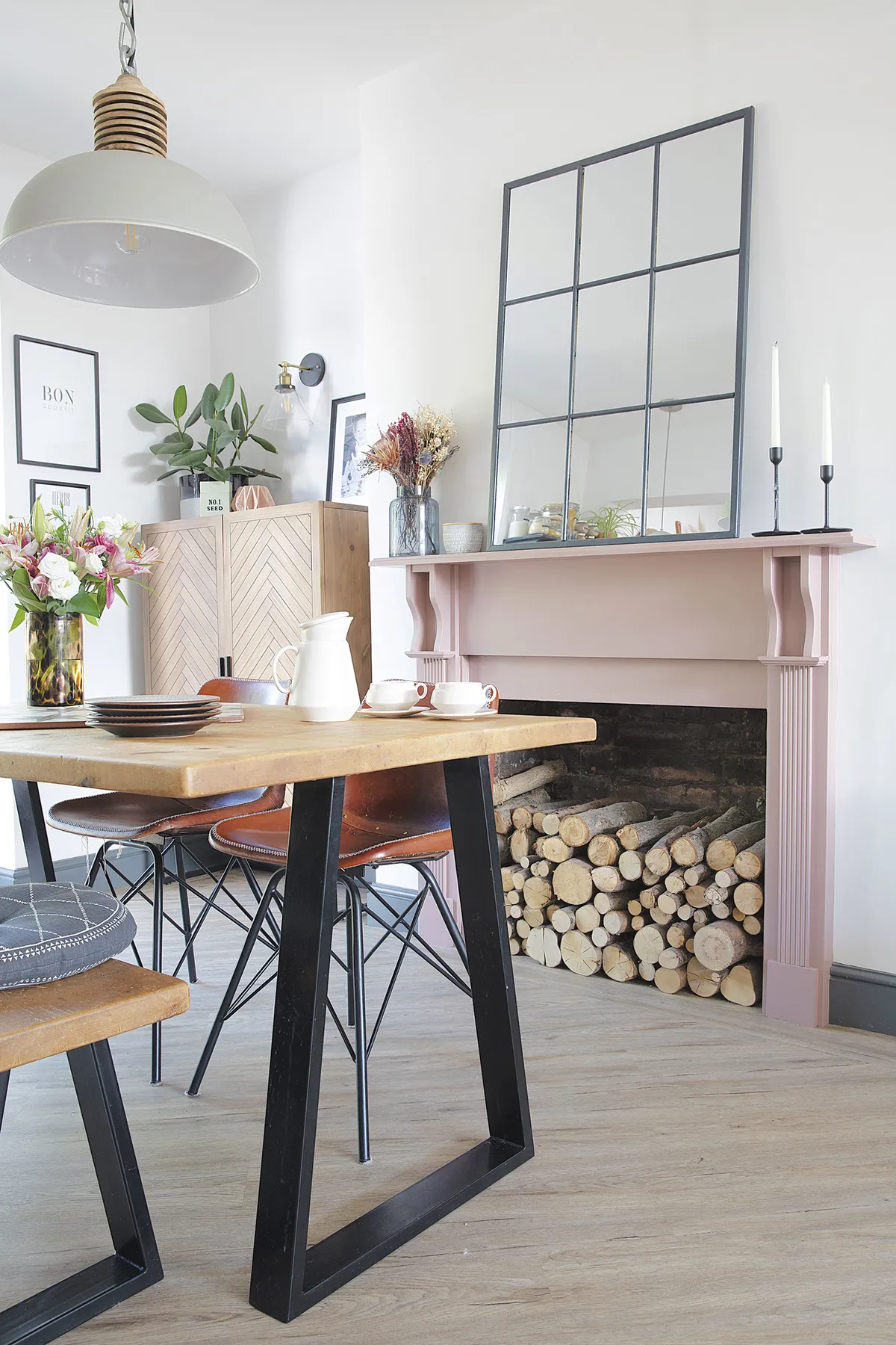 ‘The fireplace is the only thing we kept,’ says Laura. ‘I just love Sulking Room Pink by Farrow & Ball and when I painted it, it brought the whole room to life. The herringbone cabinet from La Redoute in the alcove is great for storing papers and toys too’