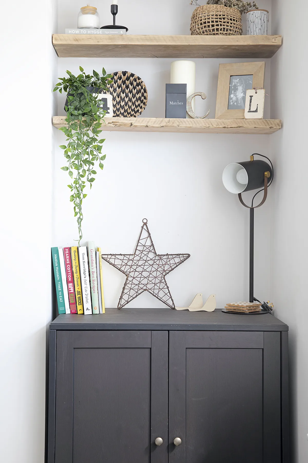 Scaffold board shelves attached with floating brackets have made the most of the alcove space, which is finished off with wicker baskets from Next and Nkuku. ‘The IKEA unit was a lucky find as it fitted perfectly,’ says Laura, ‘and the lamp from Cult Furniture adds an industrial touch’