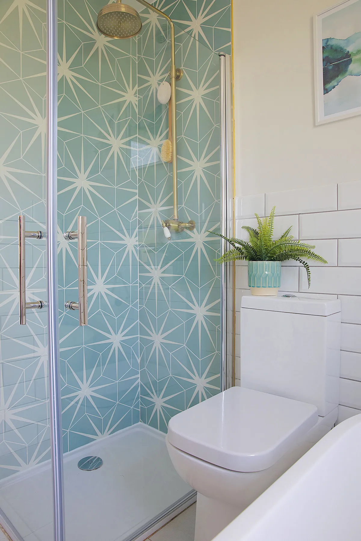 ‘Although I’ve generally tried to keep costs down by using standard metro tiles on most of the walls, the Lily Pad shower tiles from Ca’ Pietra were my little bit of luxury,’ says Laura. ‘They really make a statement and work well with the antique bronze shower from House of Enki’