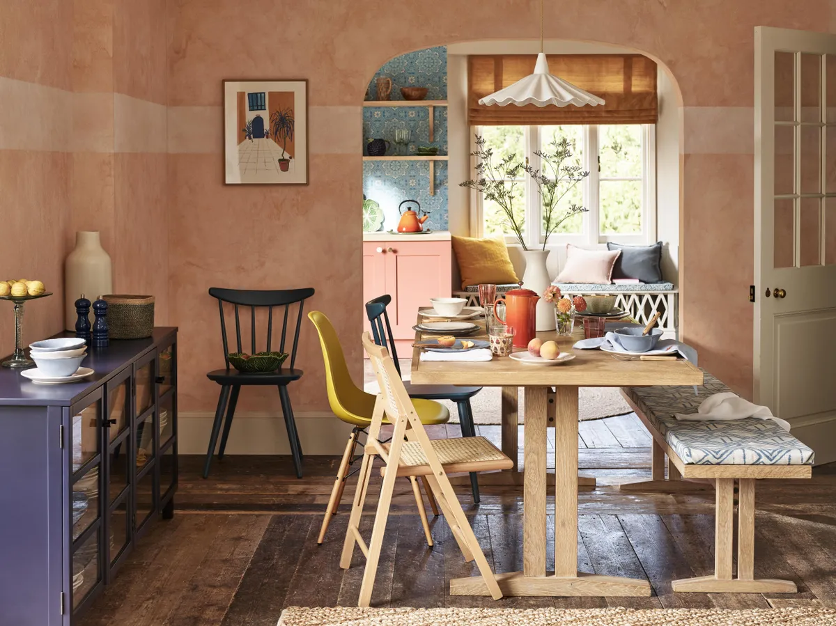 Estate 6-10-seater extending dining table, £899; Estate four-seater bench, £399; Linen cushion in Plaster, £30; Washed cotton cushion in Slate, £30; Chevron knot jute rug, £100; Le Creuset stoneware coffee press, £57; West Elm ceramic carafe vase, £25.50; Original BTC Christie ceiling light, £439, all John Lewis & Partners
