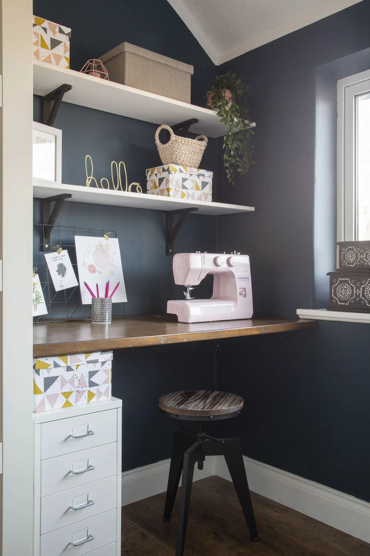 Ruth chose Farrow & Ball’s Hague Blue for the office walls to give it a rich and elegant appearance and added contrast with white shelving and storage. ‘The desk is made from a piece of plywood that I stained and David mounted to the wall,’ Ruth says. ‘It’s simple and sturdy’