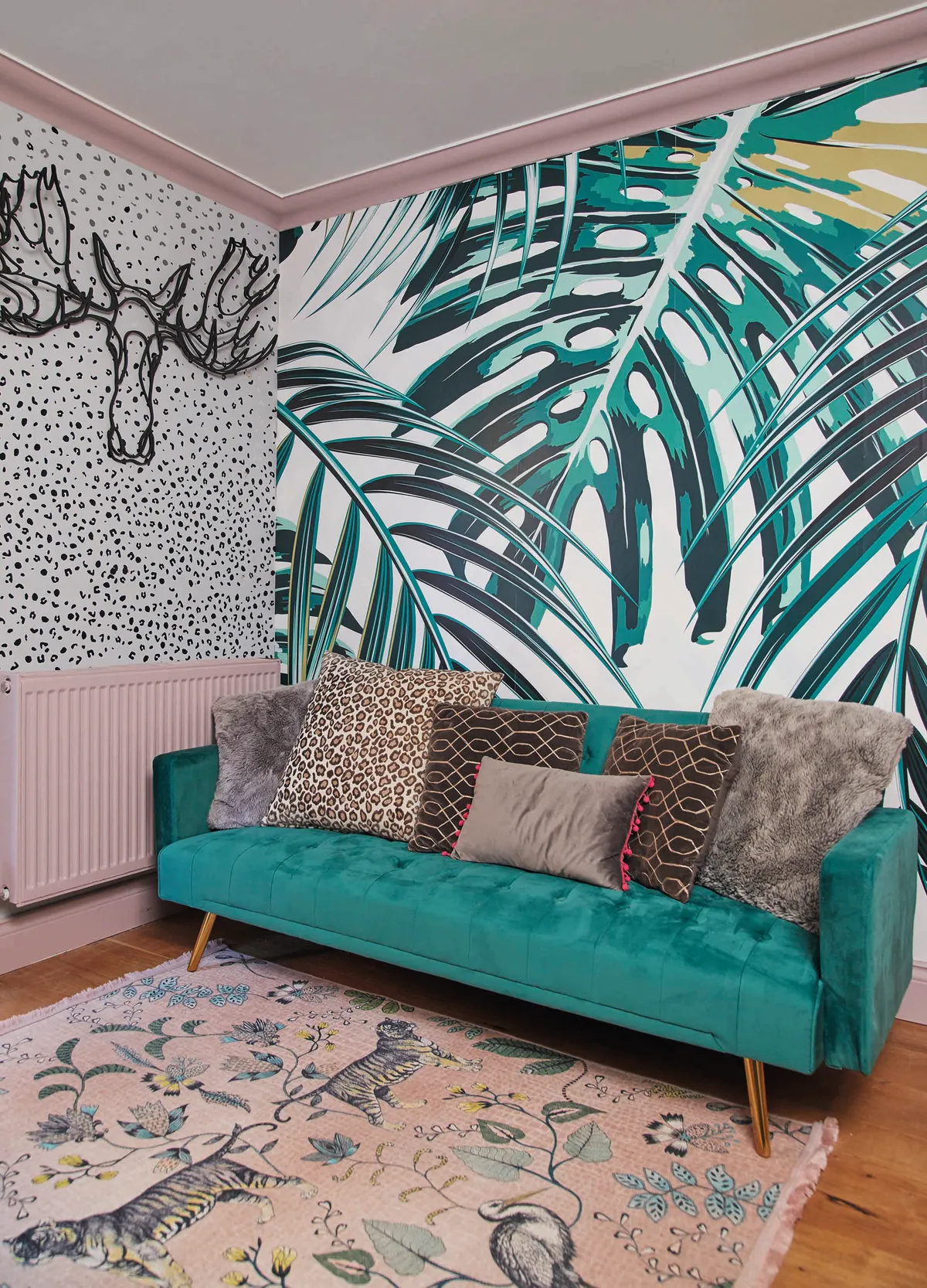 Emily's playroom features two bold wallpaper designs and a pink painted radiator