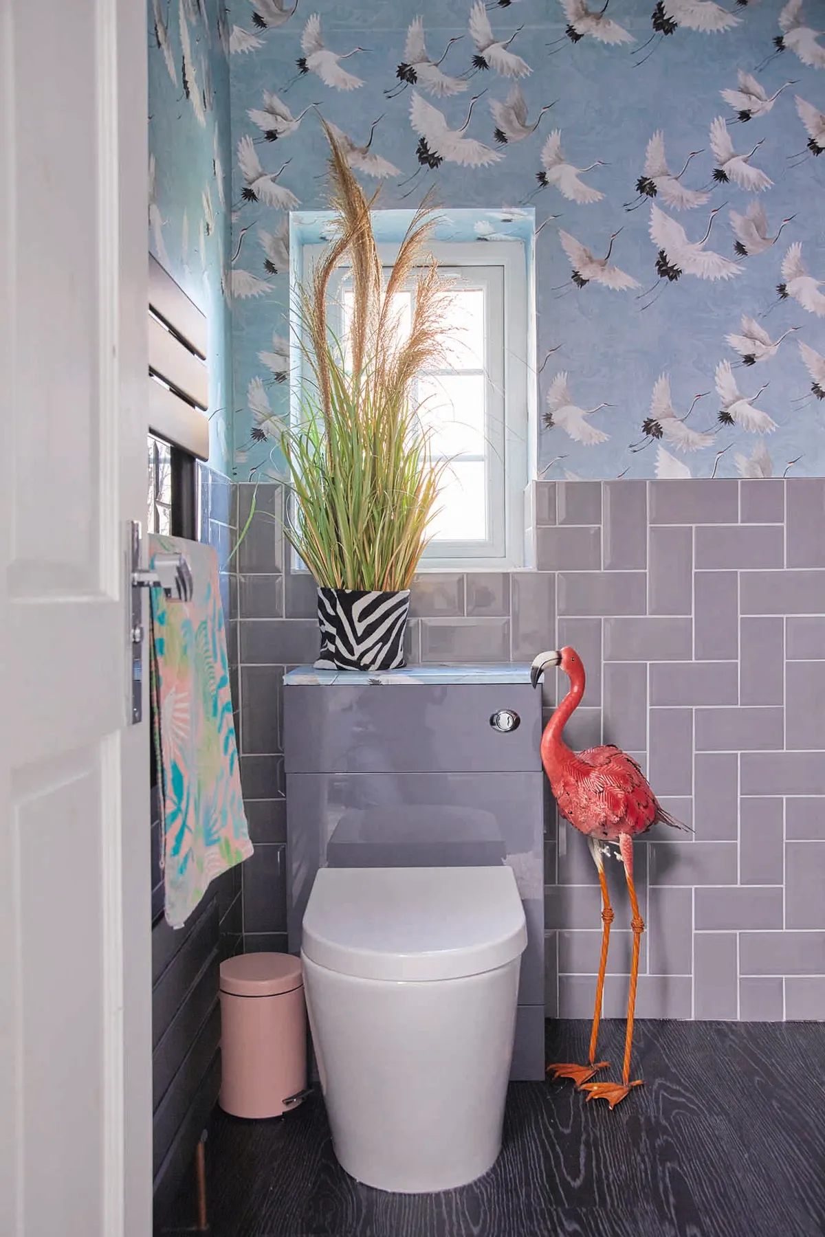 Emily's bathroom features a crane wallpaper