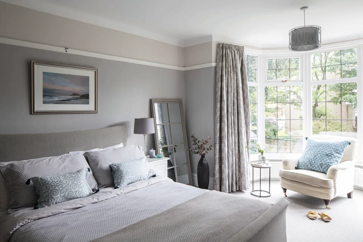 Joanne's master bedroom is painted in Farrow & Ball's Cornforth White