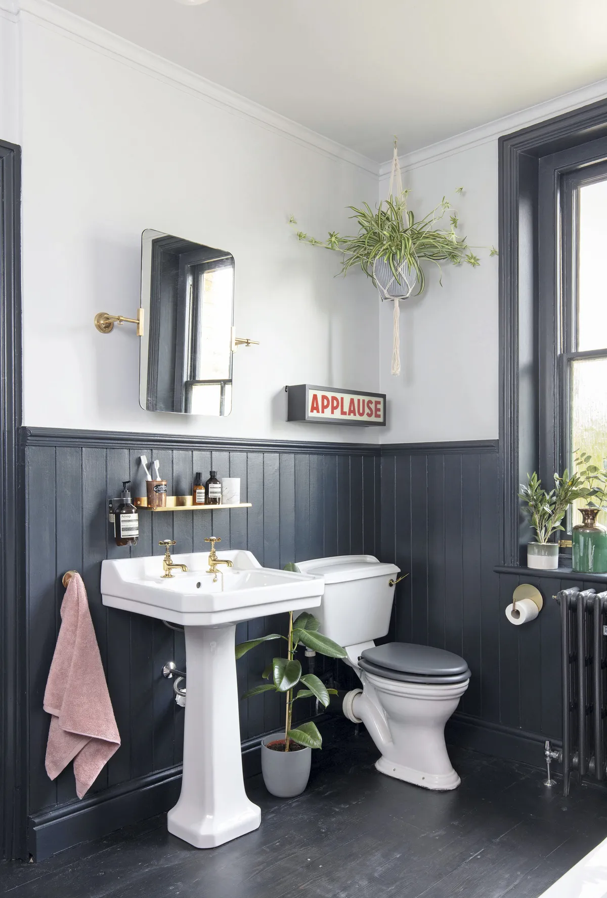 To prevent the bathroom looking too dark, the couple decided to paint just the panelling in Farrow & Ball’s Railings, leaving the top half of the walls a crisp white to give the space a fresh look
