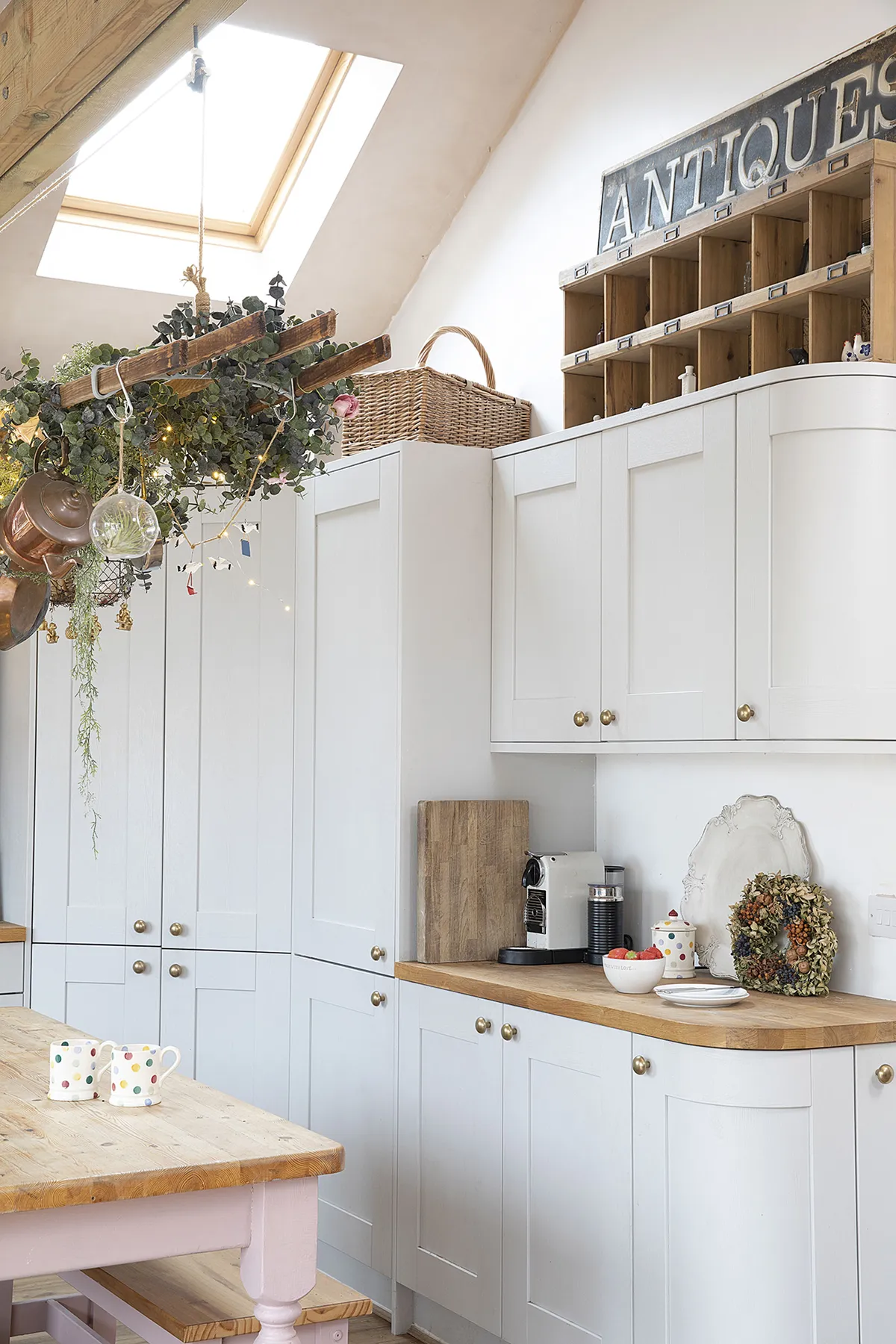 The large corner larder is home to the boiler as well as Sandra’s well-stocked pantry. ‘It lights up when