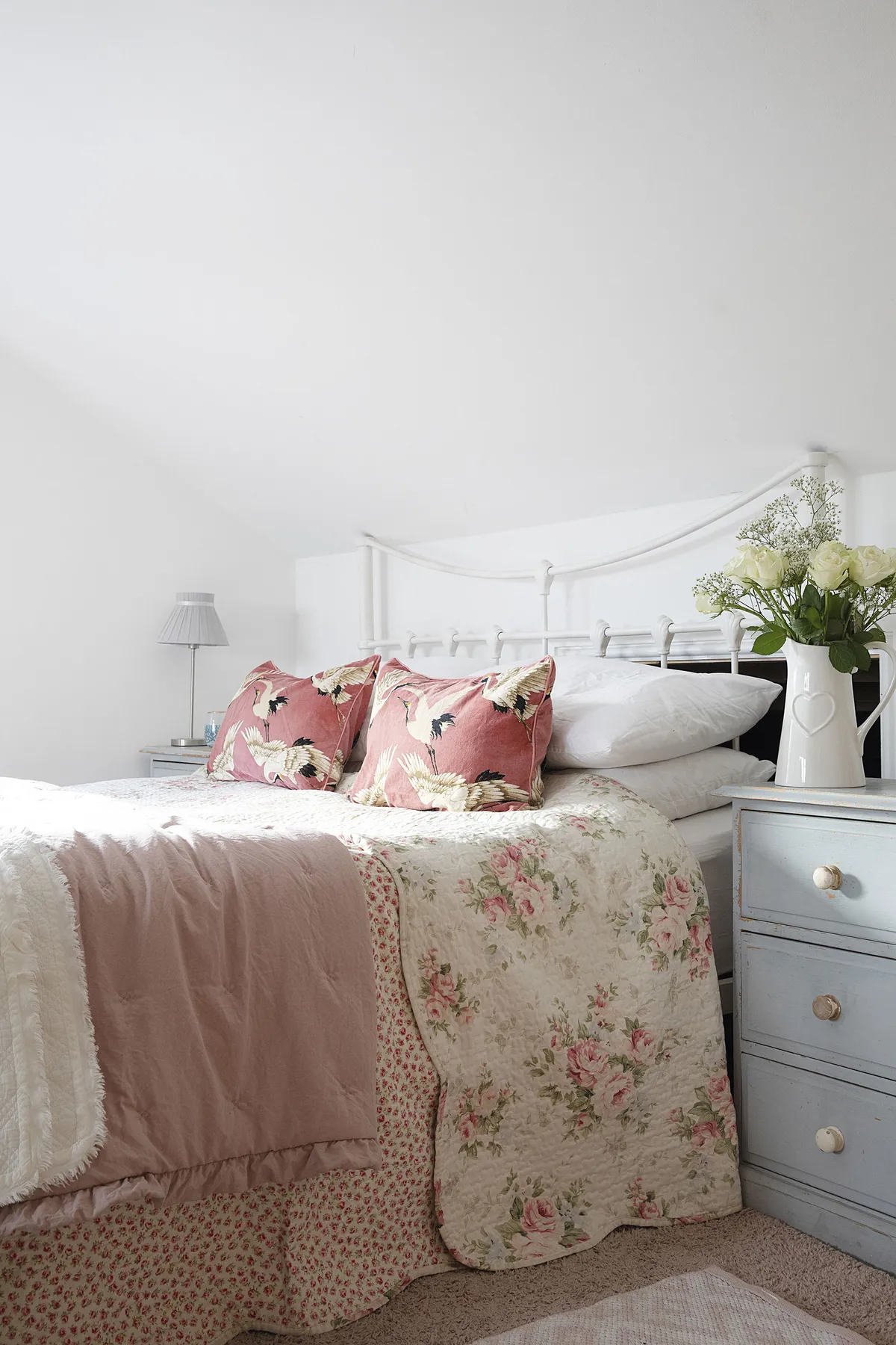 With white walls, the master bedroom has a calm feel to it, but