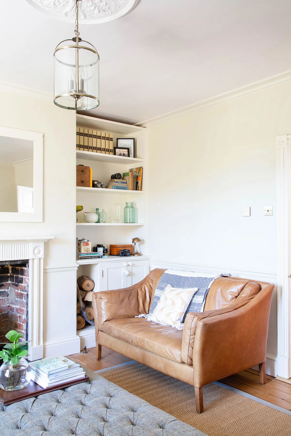 The couple restored the original floorboards, opened up the bricked-up fireplace to install a log burner, and decorated in neutrals to draw focus to the room’s character