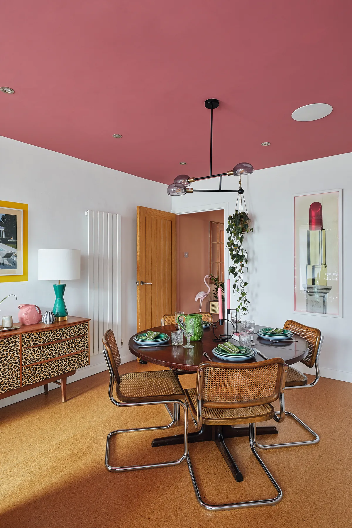 Bo's dining area with a pink painted ceiling