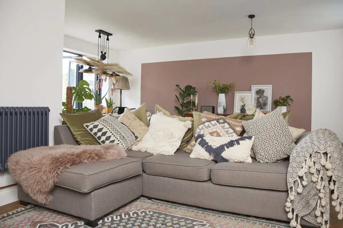 ‘When we finished the extension, I was left with this really long expanse of wall at the back, so I did the colour blocking, using my favourite colour – Sulking Room Pink from Farrow & Ball – to break up the stretch and add interest. I’m really happy that we can have this large sofa from DFS now that we have the extension’