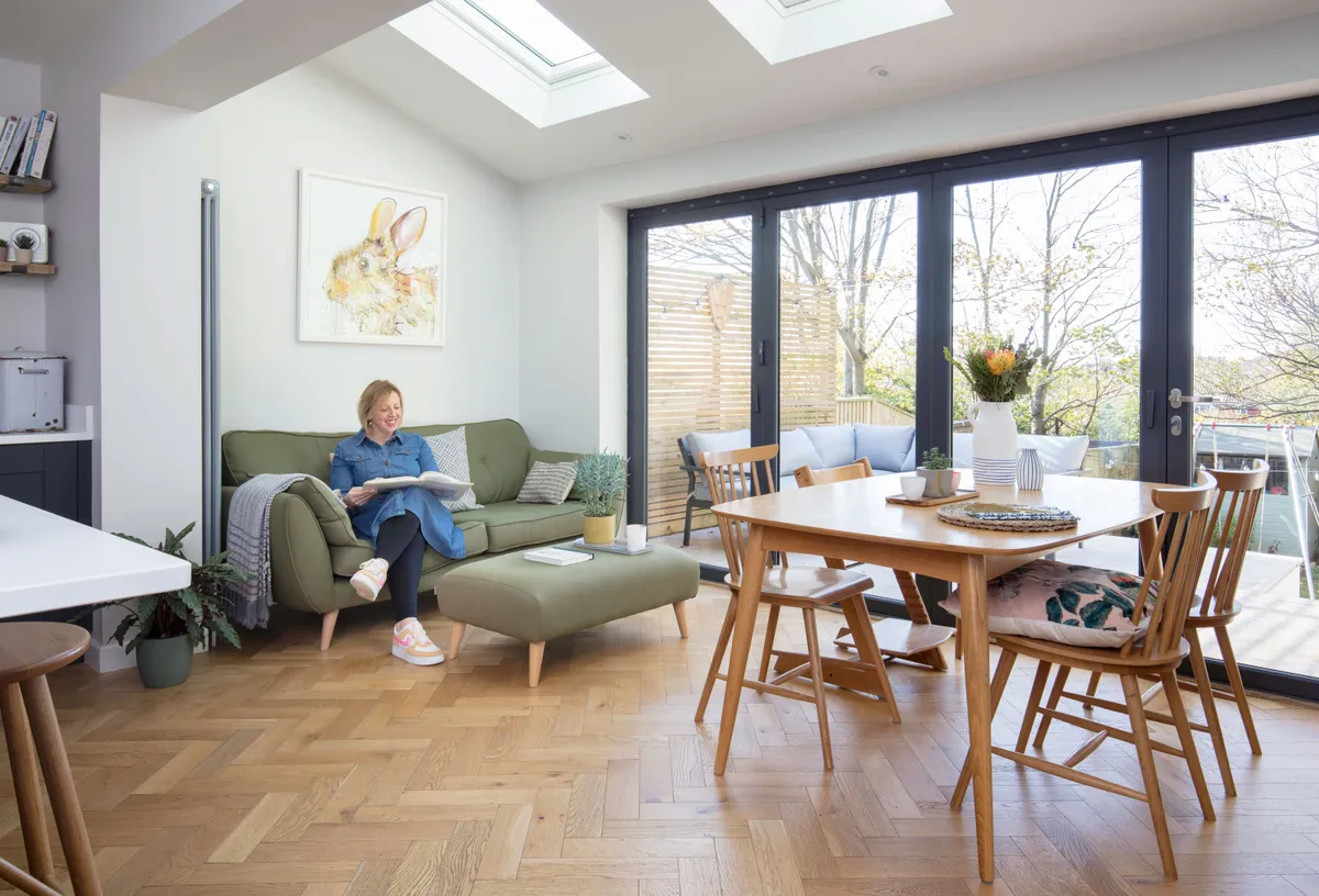 Install skylights to flood a room with light, as Sara and Lucy have in the dining and seating area – the sofa and footstool make it the perfect chill-out space