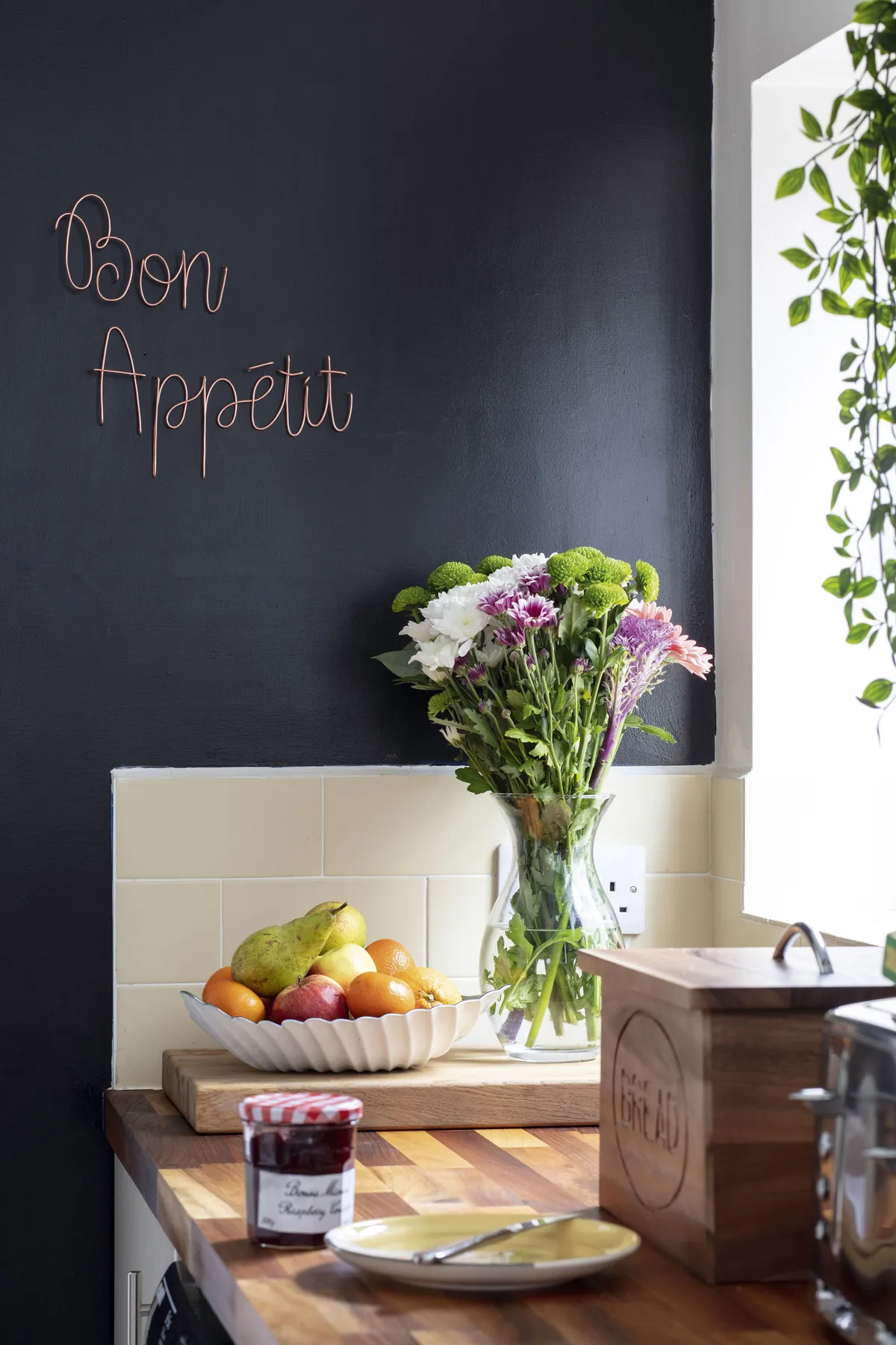 ‘We painted a wall black to create the look of a chalkboard,’ says Diandra, using Durable Liberty by GoodHome at B&Q. Copper art from Let’s Be Wired pops with the black wall behind it
