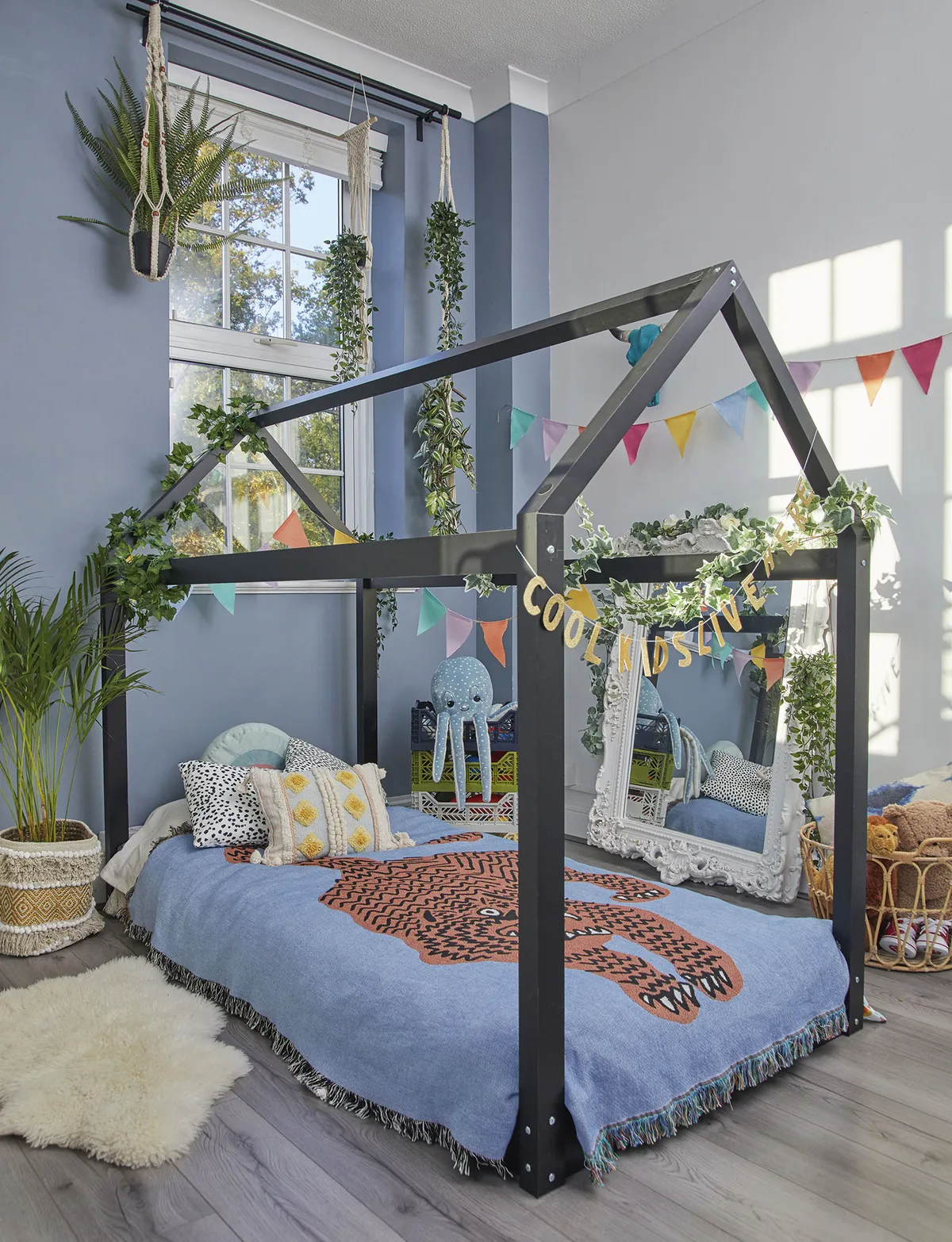‘I saw this house bed in Cox & Cox and thought how much fun it would be for Cooper as a place to play as well as sleep. The dogs seem to love it in here too’