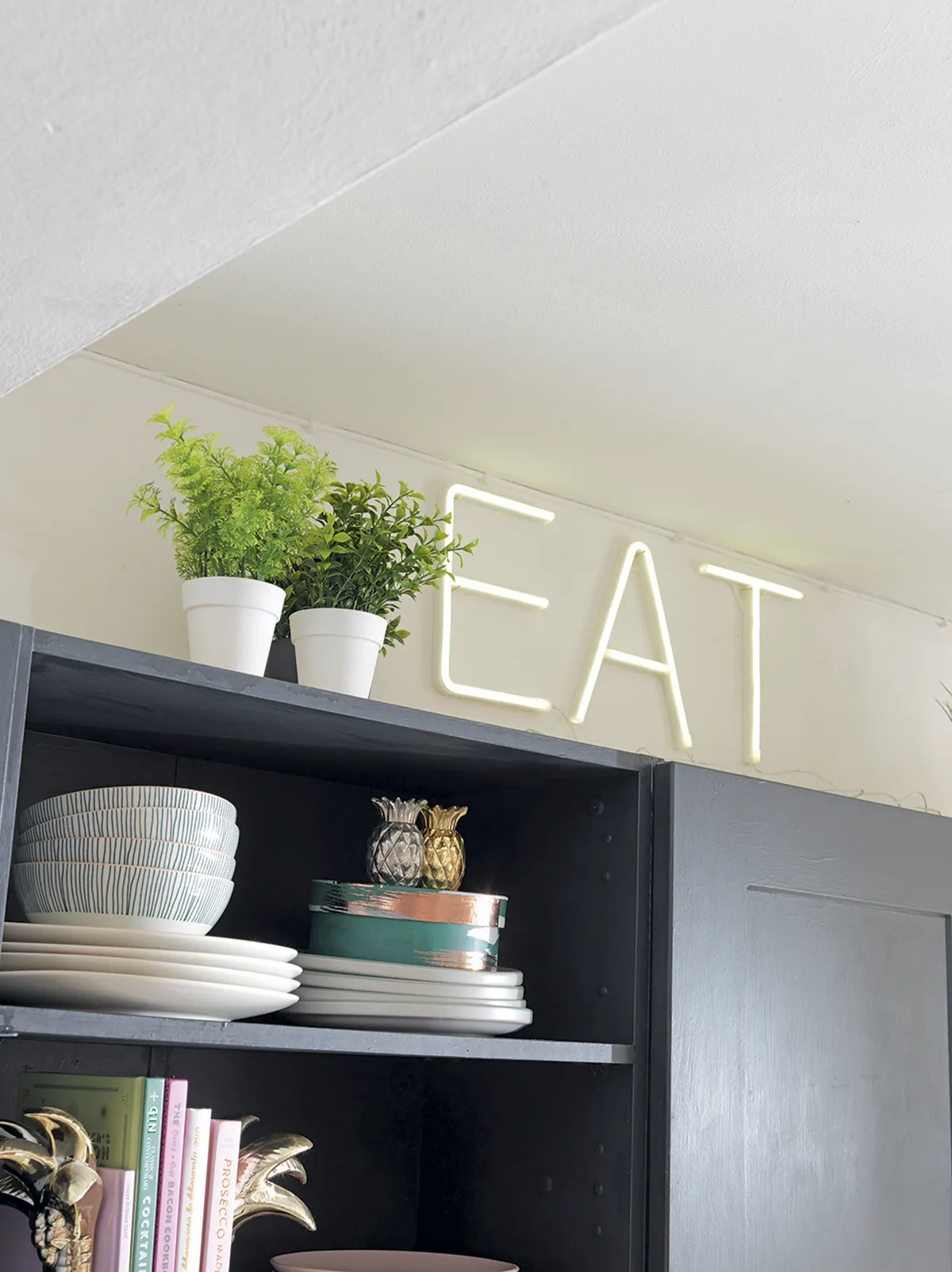 ‘The LED ‘EAT’ sign is from Home Bargains. We bought the letters individually, so you can spell out any word. They add a bit of fun to the kitchen’