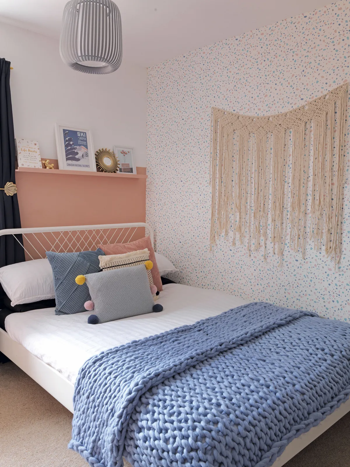 Every room in the house has lots of texture, including the spare bedroom, with wool knitted blankets, macramé wall hangings and even pompom cushion trims, giving it a cosy feel