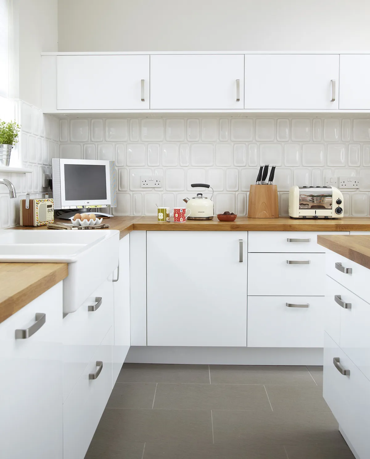 As the previous room felt so dingy, Julie made sure her extension was fresh and bright, with white cabinets and chrome finishes. The units were great value, allowing plenty of storage space for her money