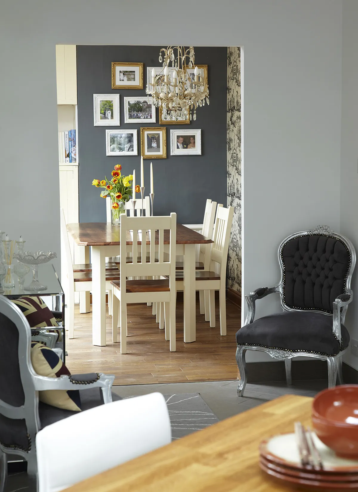 Julie has incorporated the same grey palette in her kitchen and dining area to tie the spaces together, going darker in the dining room for a cosier feel