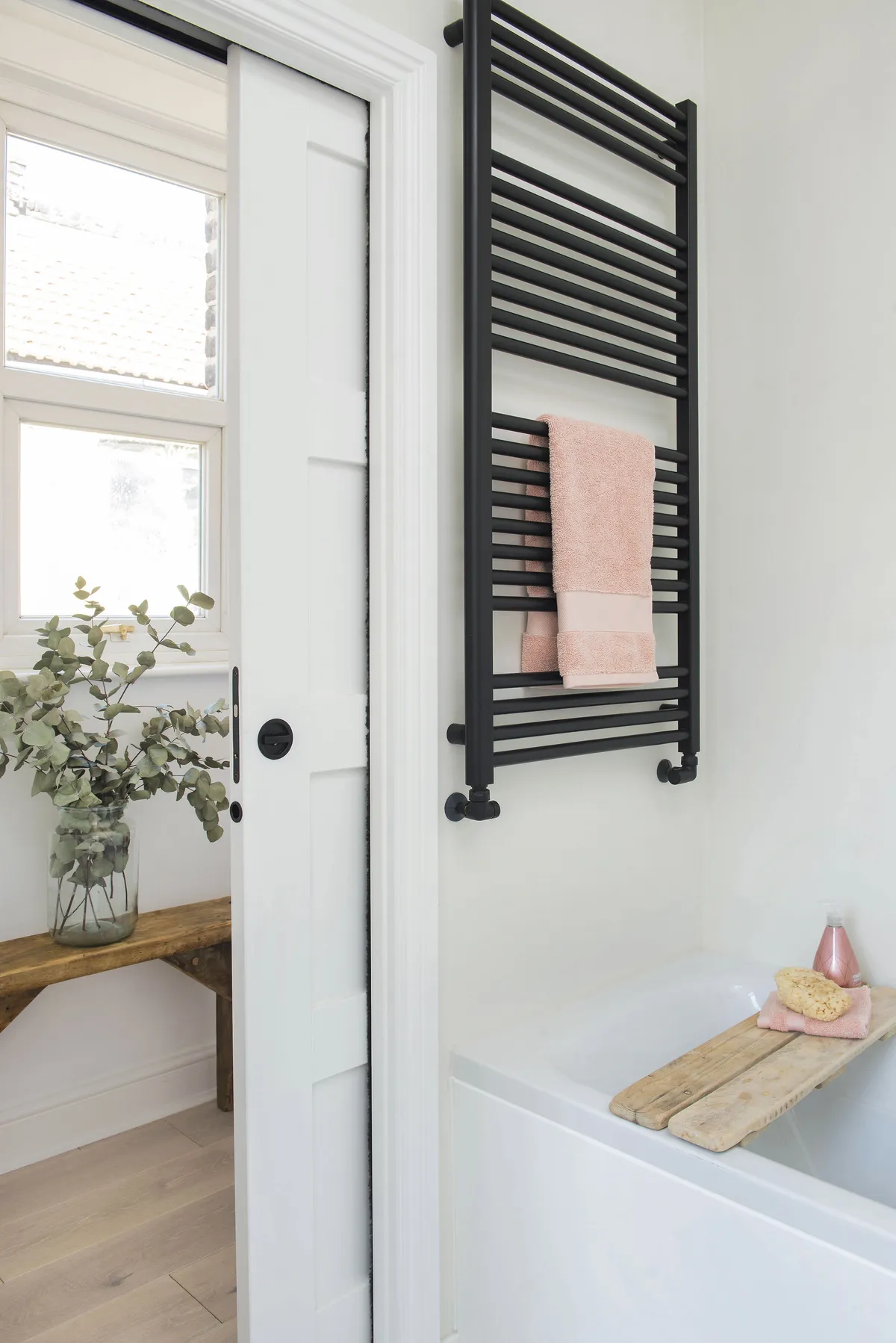 ‘The door from the kitchen straight into the bathroom wasn’t ideal, but creating the passage solved the problem,’ says Sina. ‘The pocket door is great – it’s stylish and a brilliant space-saver’