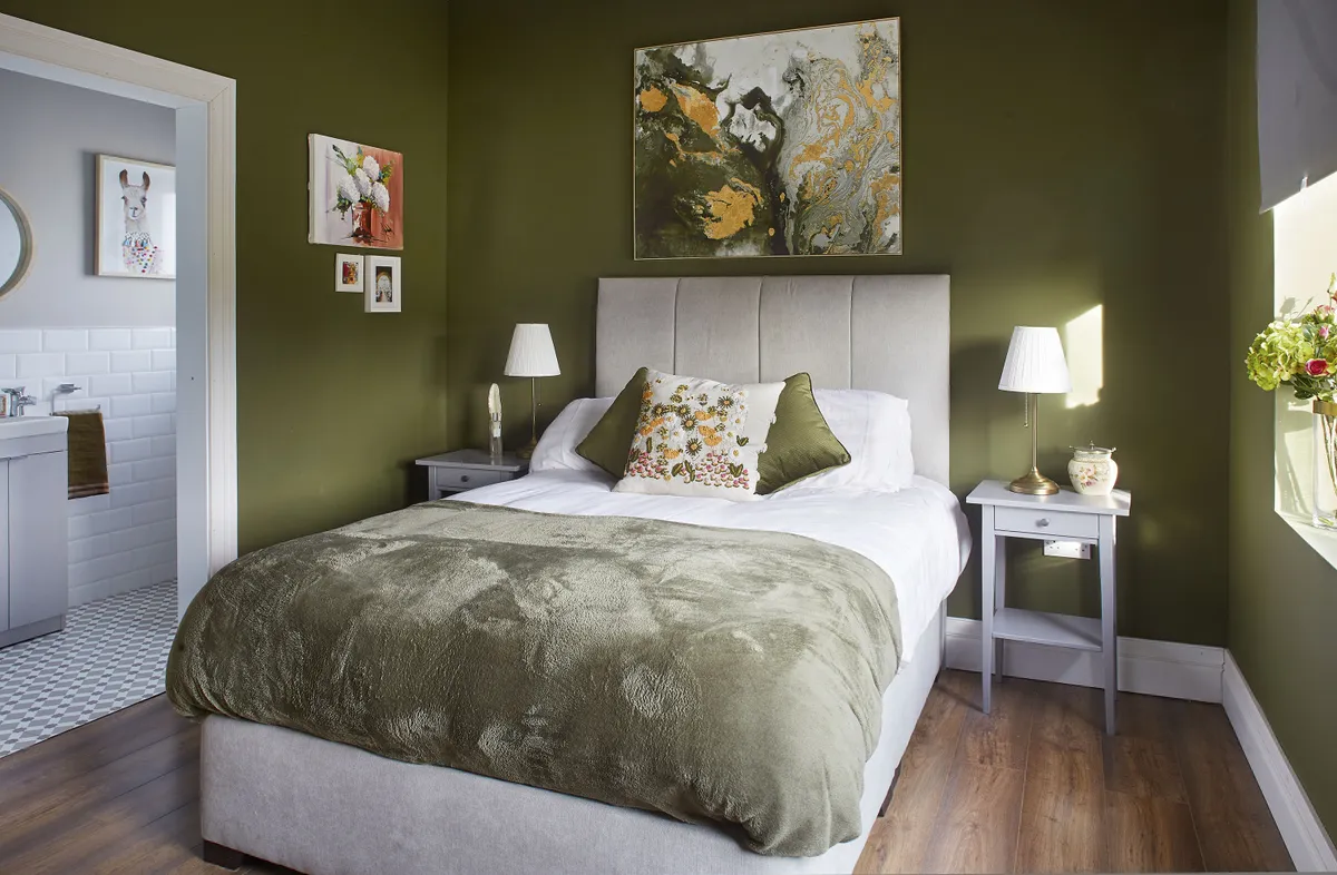Gillian chose a deep, olive green for the guest bedroom – the Moneva Meadows shade from her Carlow Paint Hub collection – to echo the landscape outside