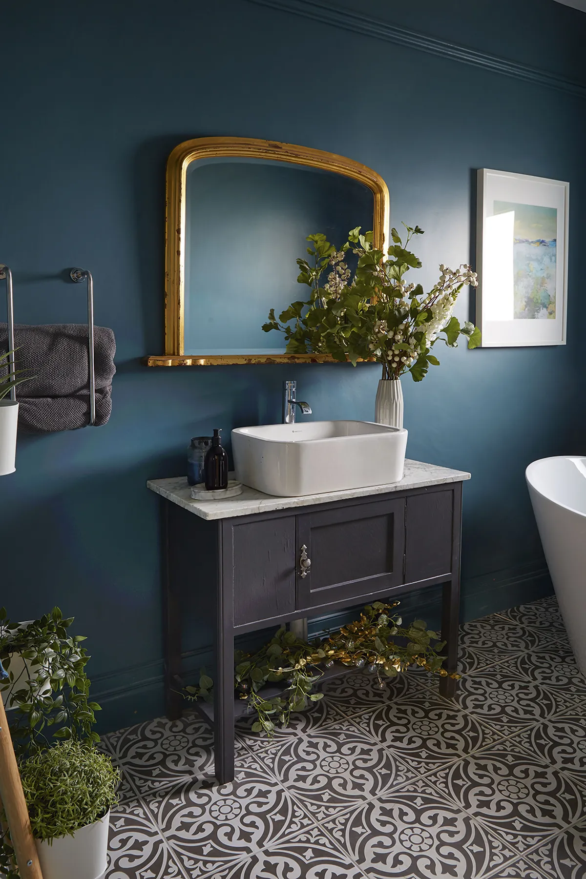 Painting the walls a sumptuous teal and adding a revamped vanity unit gave Gillian’s bathroom a luxury spa feel within her budget