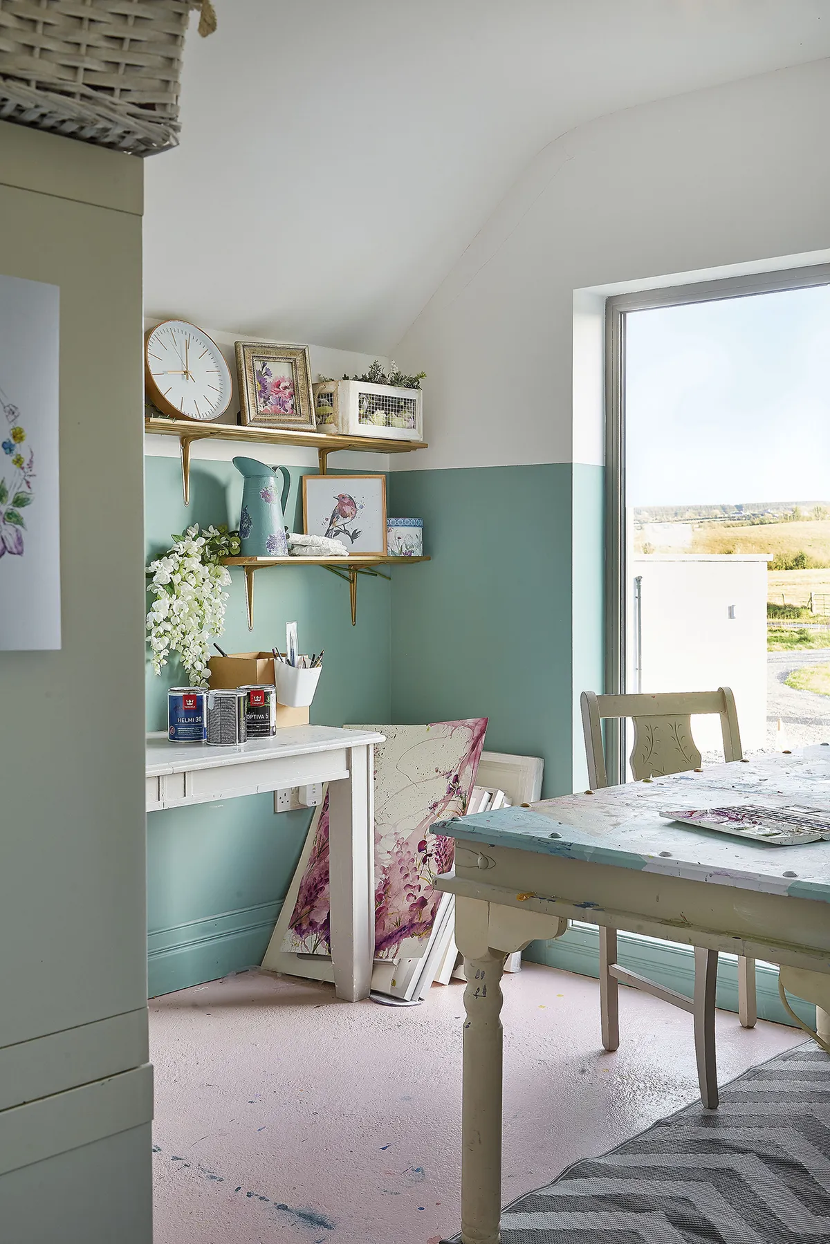 Gillian has painted three-quarters of the wall mint and the rest white to draw the eye upwards for an airy, spacious feel, accentuating the natural light