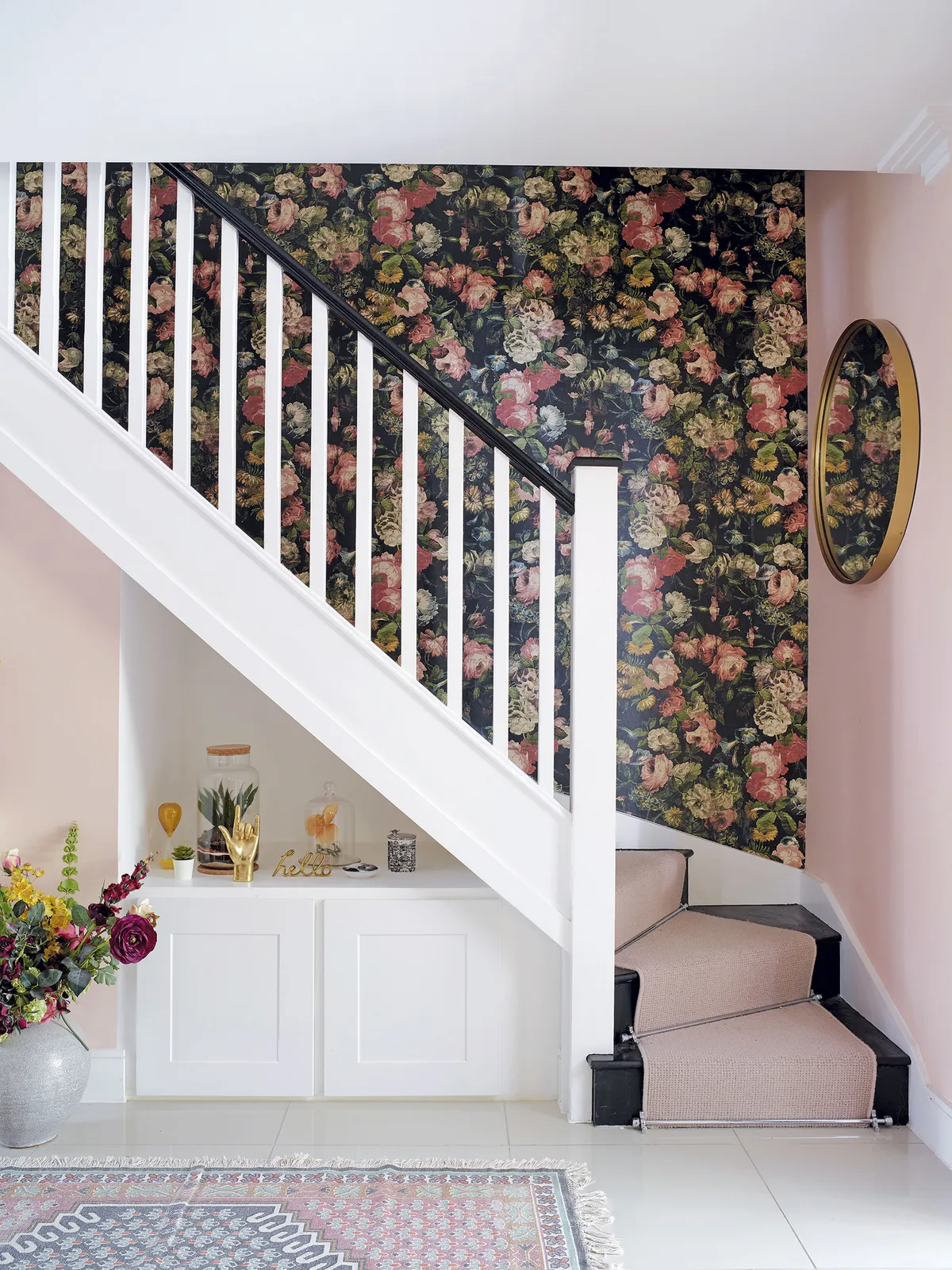 ‘I adore modern vintage homeware and rugs and love to give a sense of old to the rooms in my house,’ says Sam. The aged-effect wallpaper adds just the right amount of antique chic