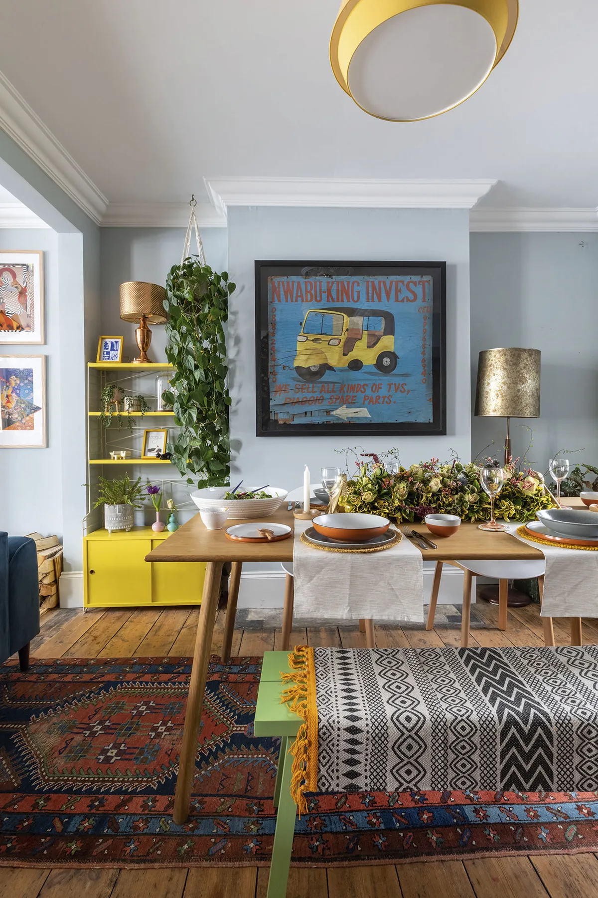 In the dining room, an African street sign Johan brought back from Malawi sets the tone for more colour, with a rainbow of crockery from Habitat. Bench-style seating makes for a cosy and sociable atmosphere