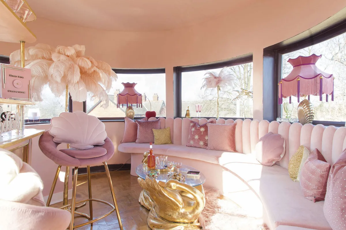 In the cocktail room, shades of pink and metallic gold accents are teamed with opulent furnishings and little nods to the Art Deco era, such as feather lampshades and prints with 30s-style fonts