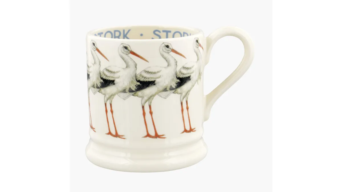 A mug with storks on a white background.