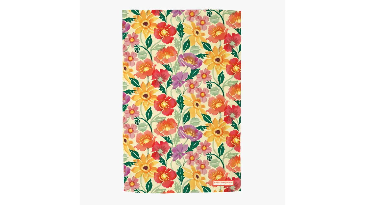 A floral tea towel on a white background.