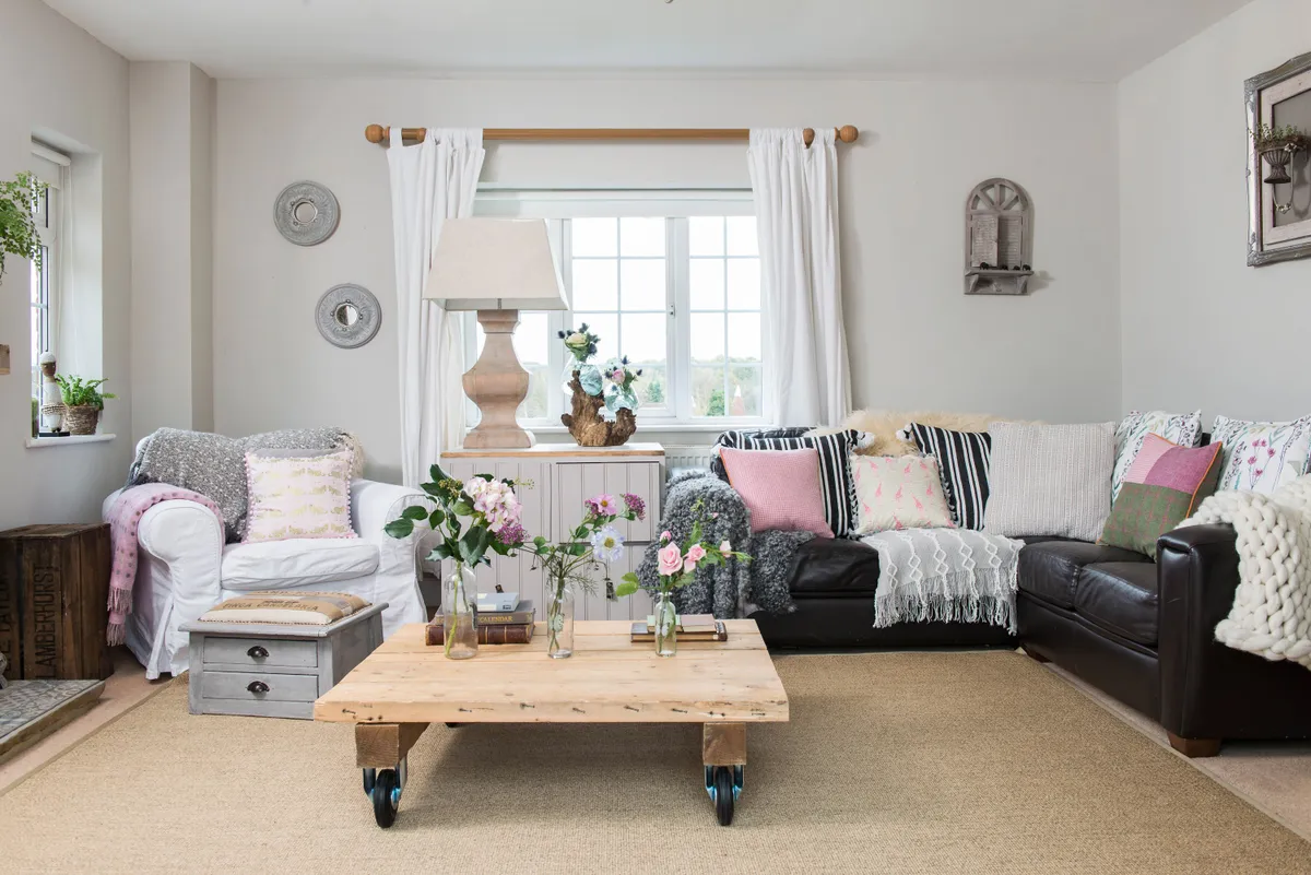 A big believer in recycling as much as possible for budget-friendly furnishings, Danecia’s cosy, double-aspect living room is full of her projects, from the DIY coffee table on casters, to the footstool reupholstered with a coffee sack